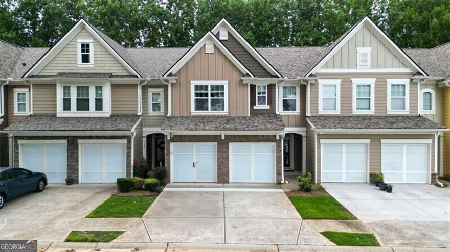 Welcome to a gorgeous townhome available now in the sought after Ellison Lake Townhome community with a LAKE VIEW-RIGHT ACROSS THE STREET! This home has been upgraded and well maintained by the owner and is Fee Simple ownership and offers the lovely feel of a single family home but without the upkeep - the HOA handles all of the lawn maintenance and you just get to enjoy the array of amenities - easy and convenient living! The main level features a 2-story foyer with 2 display niches, a beautiful chandelier and hardwood stair treads, large fireside great room, open concept dining room, and the kitchen overlooks the great room! Don't miss the large storage closet in the foyer and guest bathroom! Stunning LVP flooring on entire main level, newer light fixtures and 2" blinds! Upgraded fiberglass front door and door to garage with blinds between the glass! Kitchen features granite countertops with stainless steel appliances and an undermount sink and disposal! Refrigerator is included! The dining area features a chair rail, detailed trim and glass doors leading to a private patio! Laundry room is the perfect mud room leading into the kitchen from the garage! Upstairs features an open bonus/loft/flex space-endless possibilities here, all with gorgeous LVP flooring! The spacious owner's suite features a cathedral ceiling with 2" blinds! The ensuite bath features vaulted ceiling, walk-in closet, double vanity, large soaking tub, separate shower and private water closet! There are 2 additional spacious bedrooms and additional bathroom on this level! Brand new ceramic tiled floors in both bathrooms - stunning! Take note-.New Roof and Water Heater! Don't miss this great home, just minutes to all the amenities of Kennesaw, Acworth and Marietta, including great shopping, restaurants, KSU, Kennesaw Mountain National Park, walking and biking trails!  Ellison Lakes offers awesome amenities: Lake, Clubhouse, Fitness Room, Swimming Pool, Playground, Sidewalks.