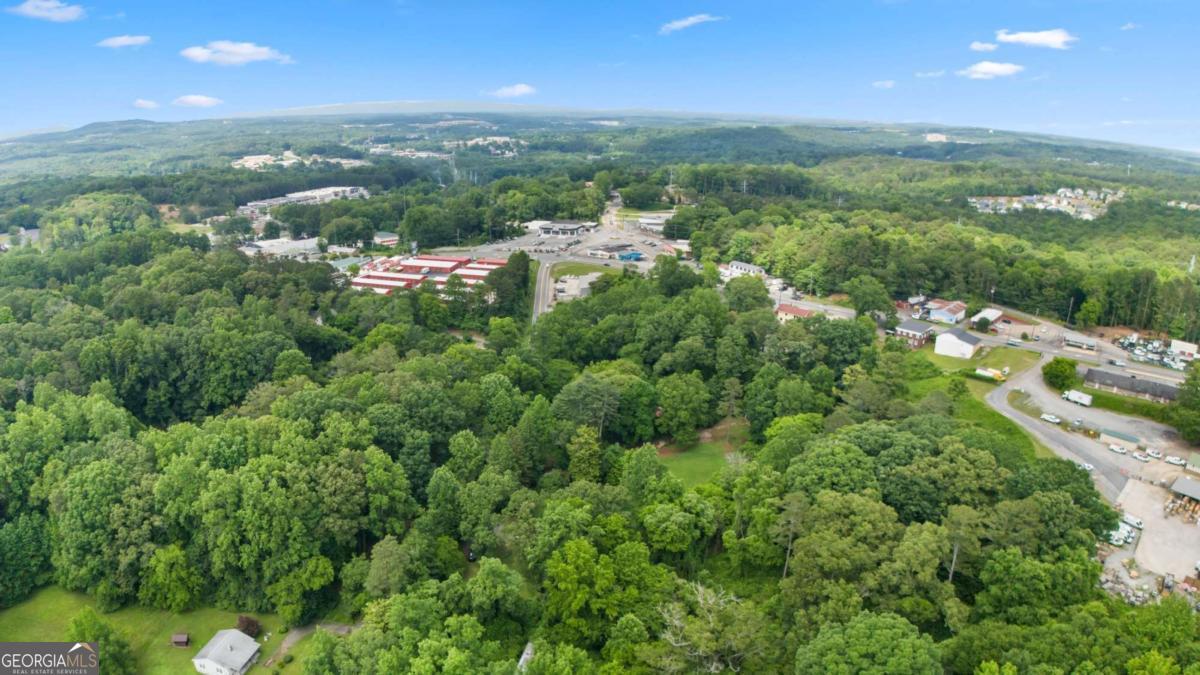 4.46 Acres with Subdivision Potential on Bells Ferry Road! Calling All Savvy Investors & Builders! Unlock the immense value of this remarkable 4.46-acre parcel located on the highly sought-after Bells Ferry Road. This expansive tract of land offers a phenomenal opportunity for subdivision into multiple residential lots, making it an ideal investment for developers looking to capitalize on Canton's thriving housing market. Imagine transforming this pristine acreage into a charming new community or an exclusive enclave of custom homes. The generous size of this parcel provides flexibility for various lot configurations, maximizing your return on investment. With increasing demand for new construction in this desirable area, the potential for significant profit is clear. Benefit from excellent road frontage and easy access, positioning your future development for success. Whether you envision a series of single-family homes or a tailored development, this 4.46-acre canvas is ready for your vision to come to life. Don't miss out on this extraordinary chance to shape the future of residential living in Canton. Secure this prime 4.46-acre development site today! Contact us for a detailed discussion on its incredible potential.