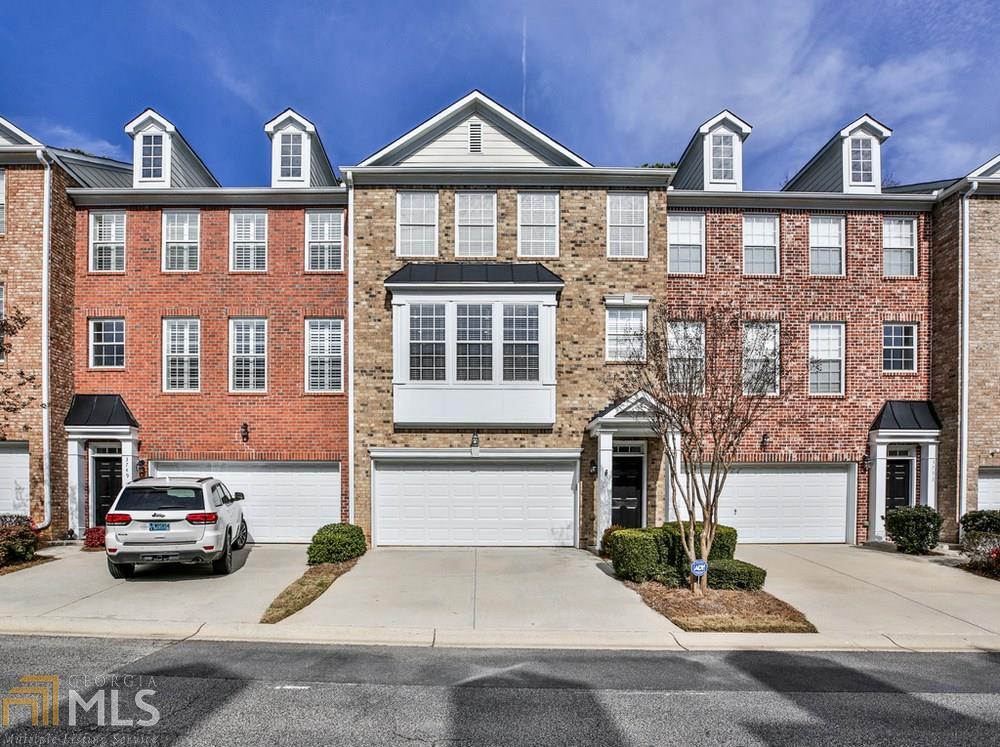 Move-In Ready Brick-Front Townhome in Prime Location! This Amazing Home is in Excellent Condition! Open Floor Plan Features Hardwoods throughout entire home, Master Suite w/Walk-in Closet & Separate Tub/Shower, 1st Floor offers an office/living space PLUS bedroom and a full Bath. Deck off living room PLUS lower level covered patio facing greenspace. Nest Thermostats, New HVAC. Roof Maintained by HOA. Gated Community. Amenities include: Pool, Clubhouse, Fitness Center & Direct Access to Chattahoochee Nature Walk Trail which leads to the river. Minutes from the Battery, Highways (285, 75 & 400). Close to Shops & Restaurants. Make Chattahoochee Bluffs your new home!