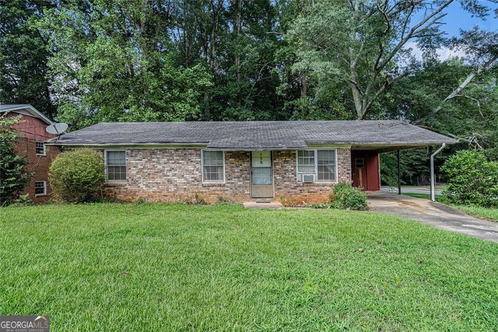 DRASTIC PRICE REDUCTION! 3 bedroom, 1.5 bathroom, brick-front fixer-upper on a large corner lot in a NON HOA community is perfect for your next project! This one-level home on a walkable crawl space offers plenty of storage and great potential to create your masterpiece. Enjoy a spacious front and backyard along with the screened-in porch that is perfect for relaxing. If convenience is top of your list, this conveniently located home is across from Garwood Athletic Complex and near I-85, dining, family entertainment, event centers, a water park, library, and a local community college. With the right vision, this home can shine-don't miss this opportunity! Schedule a showing today. As-Is.