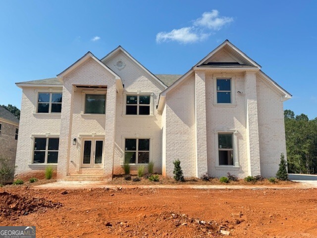 The Royal Plan features 5 bedrooms/4.5 baths and a three-car garage. On the main level are a formal living room, dining room, 2-story family room w/coffered ceilings, kitchen cabinets w/granite counter tops, tile backsplash, island, walk-in pantry, gourmet stainless appliances, hardwood floors, a half bath, and a bedroom with full bath. Stairs w/oak handrails with wrought iron spindles lead to upstairs. 2nd floor features an enormous primary suite w/sitting room, three secondary bedrooms, and two full baths.