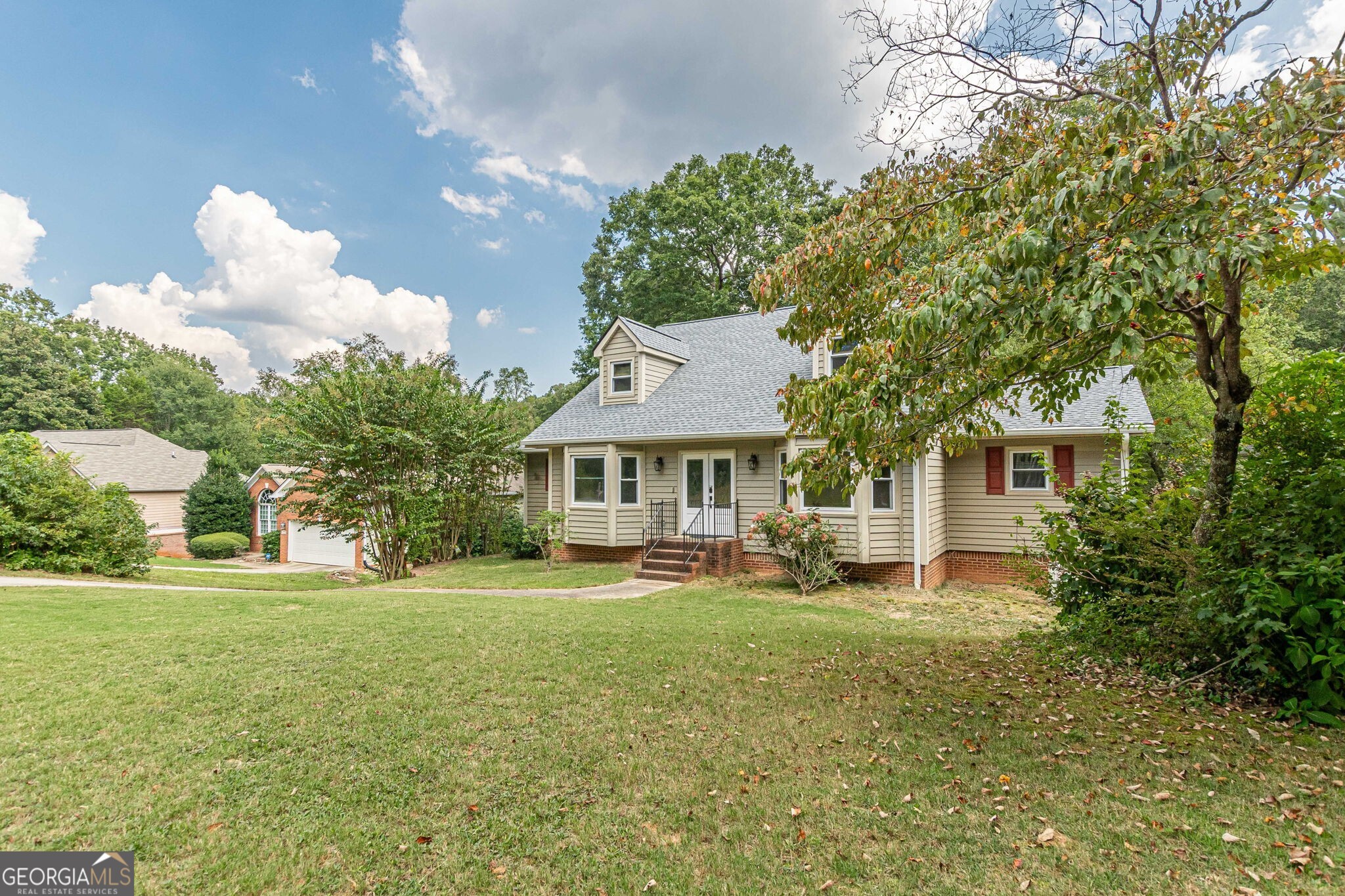 Well-Built & Updated Home in Established Neighborhood - No HOA! Beautifully maintained 4BR/3BA home on a wooded lot with creek. Spacious layout features a welcoming foyer, formal dining & living rooms, and an updated kitchen (2023) with gorgeous cabinetry, modern flooring, breakfast bar, and sunny breakfast room. All appliances stay -- including washer & dryer! The great room offers a cozy brick fireplace and opens to a large back deck with tranquil views. Owner's suite on main with dual vanities in ensuite bath. Upstairs includes two oversized bedrooms with Jack & Jill bath. Finished terrace level with additional bedroom, full bath, and bonus room -- ideal for office, rec room, or guest space. Recent updates: New siding, new roof (2024), new windows, leaf filter gutter system, whole-house generator. Exterior: Low-maintenance -- no painting needed! Move-in ready in a quiet, established community -- no HOA fees!