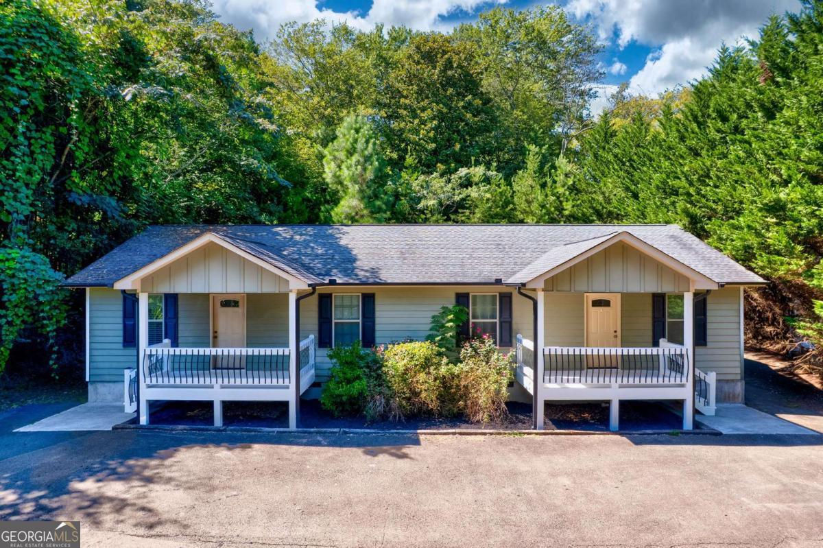 Live, Rent, & Enjoy Downtown Blue Ridge Living! Discover the perfect blend of lifestyle and investment in this 2-bedroom, 2-bath duplex located within walking distance of downtown Blue Ridge. With crisp, clean interiors and low-maintenance exteriors, this property is designed for easy living. Live in one side and rent out the other-cover part of your mortgage while enjoying all the shopping, dining, and entertainment just steps from your door. Whether you're looking for a smart way to build equity, create passive income, or simply enjoy the charm of Blue Ridge with added financial flexibility, this home is the ultimate house hacker's dream. Your lender can even use the potential rental income to help you qualify for the loan!