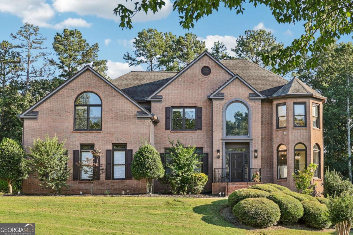 EXQUISITE three-sided BRICK HOME situated in prestigious OldeBranch section of the sought after MORNINGVIEW neighborhood, with TOP-RATED SCHOOLS and UNMATCHED AMENITIES! This ORIGINAL OWNER has maintained and upgraded over 3,900 square feet of above ground living space, and an additional 2,000+ sq ft of FULLY FINISHED BASEMENT (2016) complemented by a HUGE 3-car garage (850 sq ft!). The home has undergone extensive updates, including a COMPLETE KITCHEN RENOVATION in 2021 and ALL above ground BATHROOMS COMPLETELY UPDATED in 2025! TOO MANY UPGRADES TO LIST!! The TRUE CHEF'S KITCHEN, features a 10' center island with back-lit BLUE LOUSIE EXOTIC QUARTZITE 10' island and main sink, additional prep sink, ALL UPDATED APPLIANCES, including Fulgor Milano SIX BURNER PROFESSIONAL GAS RANGE with hibachi griddle and pot filler, separate Fulgor Milano STEAM OVEN, Wolf brand SPEED OVEN, Miele Programable BUILT-IN ESPRESSO MACHINE with grinder, Elkay refrigerated BUILT-IN FILTERED WATER STATION, Fulgor Milano paneled BUILT-IN REFRIGERATOR paneled Miele SILENT DISHWASHER, and Zeffler under counter BEVERAGE COOLER. ALL NEW custom inset solid maple cabinetry with soft-close cabinets and oversized drawers, built-in storage features, and under-cabinet lighting! Upstairs, the oversized owner's suite was completely renovated in 2025, and boasts of a jacuzzi soaking tub, tile walk-in shower, dual vanities, and a huge walk-in closet with his-hers sides. there are also three additional spacious bedrooms and two additional FULLLY RENOVATED SECONDARY BATHROOMS upstairs. The sellers COMPLETELY FINISHED the BASEMENT less than 10 years ago, adding an additional HVAC unit and an additional Electrical Panel with 220 voltage. The basement features a well-equipped media room with a fully installed electric fireplace heater, 2 generous sized bedrooms, a full bathroom, and a fully integrated wet bar with under cabinet lighting, wine rack and beverage cooler AND FULL KITCHEN, both featuring all new custom inset solid maple cabinetry with soft-close cabinets, Fisher Paykel refrigerator/freezer, double Kenmore Elite ovens, and 5 burner gas cooktop, making this space ideal for entertaining or multi-generational living! Structural and mechanical updates to the home include a ROOF LESS THAN FIVE YEARS OLD, two HVAC systems replaced in 2018 (third one is 2016), all new gutters (2022), All-updated light fixtures (2022), new neutral interior paint throughout, and new interior doors on the main level. Nestled on a private lot with mature landscaping, this MORNINGVIEW home offers direct access (across from the clubhouse) to over 10 miles of walking and biking trails, is a short walk to George Pierce Park, and just 2.5 miles to Suwanee Town Center, library, farmers market, coffee shops, and dining. Community amenities include a clubhouse, THREE POOLS including a splash pad and WATER SLIDE, newly resurfaced tennis and pickleball courts, playground, BRAND NEW clubhouse fitness center (coming in 2025!) and an active HOA. This home has been meticulously maintained and thoughtfully improved-perfect for buyers seeking luxury, lifestyle, and LOCATION!
