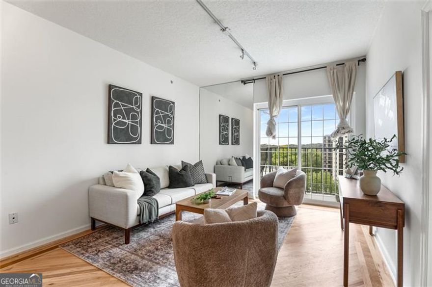 Discover the perfect blend of style, comfort, and convenience in this charming 1-bedroom, 1-bathroom condo located in the heart of Midtown. Situated within the prestigious Mayfair Renaissance building, this property offers a host of modern features and amenities designed to meet the needs of urban dwellers. Enjoy the elegance of like-new refinished hardwood floors. The condo has been updated with all new paint, providing a fresh and inviting atmosphere. The Mayfair Renaissance building has a variety of amenities, including a 24/7 concierge service, a covered, assigned parking space, a well-equipped gym, and a refreshing pool. This condo is ideally located, offering residents the vibrant lifestyle of Midtown Atlanta. Enjoy the convenience of inner city living with easy proximity to the renowned Piedmont Park, restaurants, bars, nearby public transportation, Atlantic station, easy access to I75/85, and more! Offering a combination of modern conveniences, building amenities, and prime location, this is an exceptional opportunity for anyone looking to experience the best of Midtown living. Don't miss your chance to call this place home!