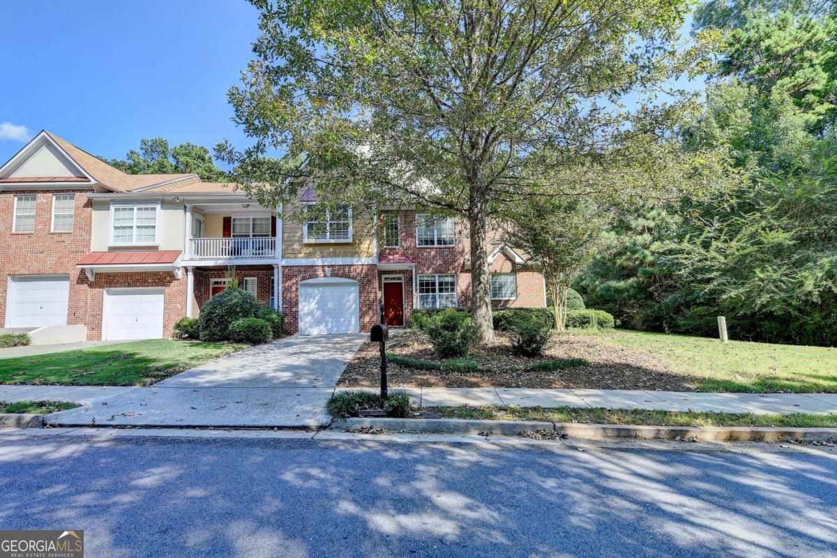 MASTER ON MAIN FLOOR! Great location! 2.8 miles to 400/Halcyon/Trader Joes, Big Creek Greenway. New 4-ton HVAC, New ceiling fans, New carpeting/padding. Highly desired End unit townhome with loads of natural light, rare main floor primary bedroom and expansive primary bathroom. Large private back and side yard. One of the best open concept floor plans in the neighborhood with 2 story stacked stone gas fireplace, pass through solid surface countered island kitchen with a separate den that leads to a private patio area and expansive back yard. 17-acre lot that backs up to community property making for a very large private back yard feel. 2548 square feet of living space. 3 large bedrooms upstairs plus a nice loft space that would make a great game room or TV space or extra office space. Large island kitchen with direct venting over the double oven gas range, newer dishwasher and newer LG French door refrigerator. The Den off the kitchen that would make a great home office, breakfast room/keeping room. Main floor Powder room located near the laundry room. Real stained hardwoods on the main floors with brand new plush high-end Karastan wall to wall carpet. Easy convenient walk to the pool/cabana. HOA fee includes trash pick-up, exterior maintenance, yard maintenance, Termites/pest, Insurance, swim, community grounds maintenance and termite service! transferable Home warranty. No rental restrictions! Excellent Forsyth County schools!!!