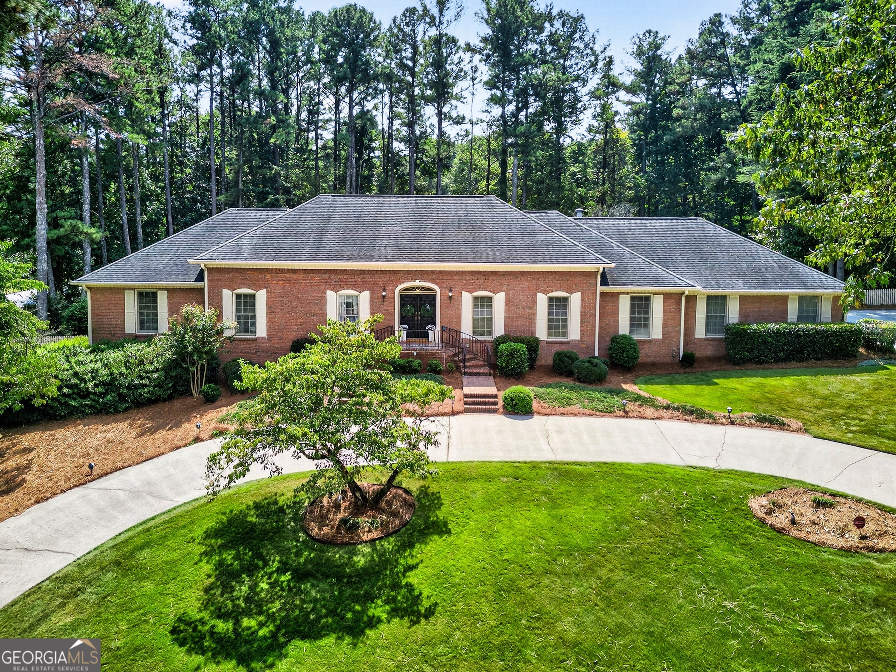 A true Estate in every sense, this all-brick, sprawling ranch offers elegance, scale, and comfort on a prominent corner lot with circular driveway. Designed for gracious living and unforgettable entertaining, this home blends timeless architecture with resort-style amenities. Four oversized bedrooms on main level, including serene owners suite. Grand formal living and dining room, ideal for hosting gatherings large or small. Inviting family room with vaulted ceilings, wood beams and brick fireplace. Bright functional kitchen with seamless flow to entertain. Oversized laundry room and mudroom with abundant storage. Relaxing screened in porch overlooking the estate grounds. The finished terrace level is the ultimate entertainment hub. Sprawling area with fireplace and bar, two additional bedrooms and private office. Rich wood-paneled finishes for timeless character. Generous unfinished areas for storage or customization, and easy walk-out to access the beautiful grounds. DID I MENTION THERE IS A WALK UP ATTIC (UNFINISHED!) Step outside to your backyard oasis built for entertaining: A beautiful tiled Gunite pool with spa, perfectly paired with an expansive patio for lounging and entertaining. A dedicated pool house with restroom, makes this retreat as functional as it is luxurious. This home has been well taken care of and THIS PROPERTY IS MORE THAN A HOME- IT'S AN ENTERTAINERS DREAM ESTATE. WITH SO MUCH IN THIS BEAUTY, THE BEST WAY TO APPRECIATE IS COME SEE IT FOR YOURSELF TODAY AND ADD YOUR PERSONAL TOUCH! THEY DONT BUILD THEM LIKE THIS ANYMORE!!!!!!!!