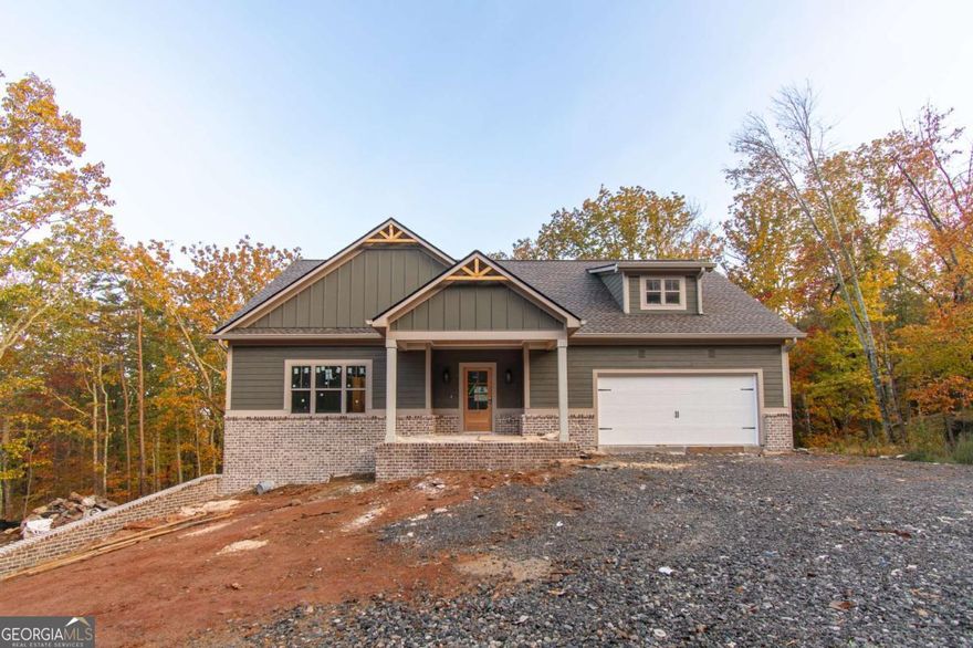 Amazing New Construction Home!    Welcome to this stunning 4-bedroom, 3-bathroom new construction home featuring an open, stylish design and a full unfinished basement ready for your personal touch.    The chef-inspired kitchen boasts solid wood cabinetry with soft-close doors, leather-finished granite countertops, a spacious center island, stainless steel appliances, and a large walk-in pantry with custom shelving and a frosted glass door.    The primary suite offers a touch of luxury with a tongue-and-groove coffered ceiling, a custom wood-shelved walk-in closet, and primary bath featuring a double vanity, large tiled shower, and private water closet.    Beautiful LVP flooring flows through the main living areas, while the upstairs bedrooms feature cozy carpeting. The inviting living room centers around a brick fireplace with a solid wood mantle, complemented by crown molding, stained barn doors to the laundry room, ceiling fans in both the living room and primary bedroom, and a tankless water heater for energy efficiency.    The home's exterior combines elegance and charm with a brick front skirt, Board and Batten accents, a covered back porch and deck, and a welcoming front porch-perfect for relaxing or entertaining.    This thoughtfully designed, open-concept home truly has it all. Schedule your private showing today-this one won't disappoint!