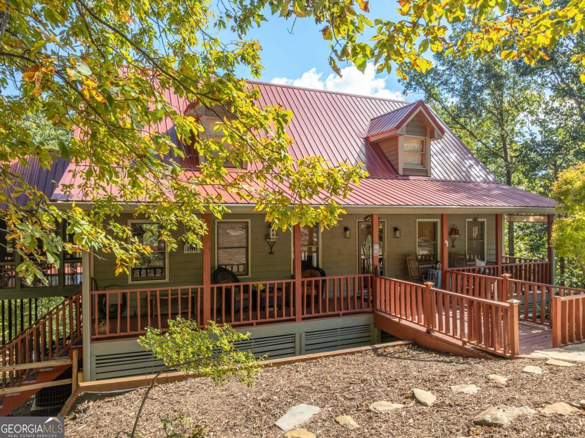 Welcome to 86 S View Trail in Jasper, GA! Nestled on over an acre lot, this charming home offers 4 bedrooms and 3.5 bathrooms. Enjoy a bright, open living space that seamlessly connects to dining and relaxation areas. The primary suite includes a private bath, while additional bedrooms provide flexibility for guests or a home office. Step outside to expanded decking with seasonal mountain and lake views. Recent updates include a new roof and expanded decking. This beautiful home offers convenient access via the back gate. Located in Bent Tree, you'll enjoy amenities like an 18-hole golf course, swimming pools, tennis courts, a stocked lake, hiking trails, and more. With gated security, a fire department, and a community water system, it's secure and self-contained. Whether a primary home or vacation retreat, experience mountain living at its finest!