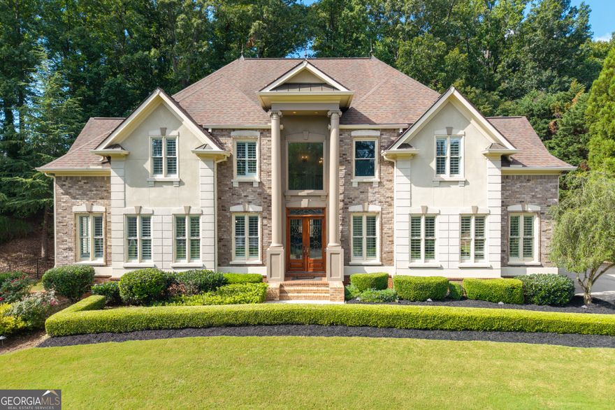 Exquisite Luxury Home in West Cobb - A Dream Residence Awaits You! Welcome to this breathtaking estate in the highly sought-after neighborhood of West Cobb. This 6-bedroom, 6-bathroom home offers unparalleled luxury, from its grand architectural design to its exquisite, newly renovated interiors. Situated on a beautifully landscaped lot, this home is perfect for those seeking the ultimate in comfort and style. As you enter you'll be immediately captivated by the dramatic two-story columns and brick steps that lead to double mahogany doors. Inside, a magnificent two-story foyer with a dome ceiling and extra-wide spiral staircase with elegant metal spindles set the tone for the rest of the home. Luxurious hardwood floors have been recently finished throughout, complemented by custom wooden plantation shutters, ensuring a warm and sophisticated ambiance. The formal dining room boasts crown molding with custom up-lighting and a recessed accent ceiling, while the formal living room offers abundant natural light and ample space for entertaining. The chef's kitchen has undergone a complete renovation, featuring gleaming quartz countertops, a Butler's cabinet/coffee bar, an island with breakfast bar, double wall ovens and a gas cooktop with a custom hidden range hood. A huge walk-in pantry and a unique circular breakfast room surrounded by windows offer serene views of the meticulously landscaped backyard. Adjacent to the kitchen, you'll find a cozy keeping room with a gas fireplace, providing the perfect setting for casual gatherings. Upstairs, the oversized primary suite is a true retreat with a tray ceiling and a spa-inspired ensuite bathroom featuring an enormous dual- shower, double vanities, a luxurious jacuzzi tub, and an expansive walk-in closet. The three additional secondary bedrooms are generously sized, each with their own ensuite bathroom featuring tiled showers and tubs. An added feature upstairs is a charming children's retreat or flexible bonus space for extra storage. The fully finished basement reflects the same high-end finishes found throughout the main levels. It features a spacious family room with brand-new flooring, a stylish full tile bathroom, and a versatile space that was previously the sixth bedroom-now envisioned as a remarkable media room. Outfitted with elevated flooring, a projector screen, a sound system, and a bar area, it's already primed for unforgettable movie nights and entertaining. Prefer a bedroom instead? The space can be converted back to a bedroom. Think of it as your blank canvas, ready to be customized to fit your lifestyle. Step outside to your personal oasis, where a newly enclosed patio leads to a 18x36 Gunite saltwater pool, with heating capabilities, ideal for cooling off on a warm summer day or enjoying a relaxing evening swim. Enhancing the comfort and functionality of the outdoor space, right off of the kitchen, is a retractable awning providing shade and flexibility for outdoor relaxation. Additional highlights include two brand-new AC units, fresh interior paint, an irrigation system, privacy landscaping, and a Pebble Technology floor coating in the three-car garage. Ideally located in Marietta, this exceptional home provides access to some of Cobb County's top-rated schools and is just minutes from the scenic trails of Kennesaw Mountain. You'll also enjoy proximity to upscale shopping, fine dining, and premier entertainment at The Battery at Truist Park. Don't miss the rare opportunity to make this stunning home yours! It's a rare find and a must-see!