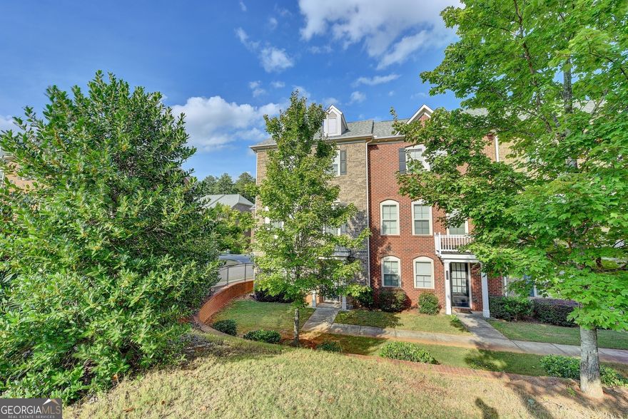 Former model home! Amazing light filled End Unit; Hardwood floors throughout; tiled baths; Open concept with Chef's kitchen features stainless steel appliances, custom wood cabinets, granite counter tops, Subway tiled backsplash, breakfast with door to deck and views the dramatic fireside family room. Glamorous owner's retreat with trey ceiling, walk-in closets, garden tub, separate shower, tiled floors, dual vanities; 2 additional bedrooms, tiled bath and laundry room upstairs; 4th bedroom and 3rd full bath in the terrace level;  2 car rear entry garage; minutes to Avalon, downtown Alpharetta, North Point mall, Ameris Amphitheater, Greenway, Windward business center, medical facilities, dining choices, etc.... Only small pets allowed- pet fee is determined on breed and size