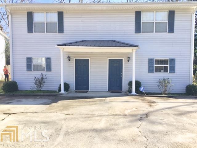 Small, quiet, community with 4 duplexes (8 townhomes) tucked away on 1.39 acres in Historic Old Town Conyers. Unique property with long driveway surrounded by trees in area with single family homes. Rent $5975 mo/$71,700yr. Each townhome has an open living/dining/kitchen with 1/2 bath on main & 2 bdrms upstairs each with their own private full bath and upstairs laundry. Walk to restaurants, shops, library, festivals, events...etc. New Metal roofs. No pets. No sign on property. Property is occupied. DO NOT disturb tenants. 879/881 Rosser St is being sold with 883/885, 887/889, & 891/893 Rosser St. $850k total. Will not sell buildings separately.