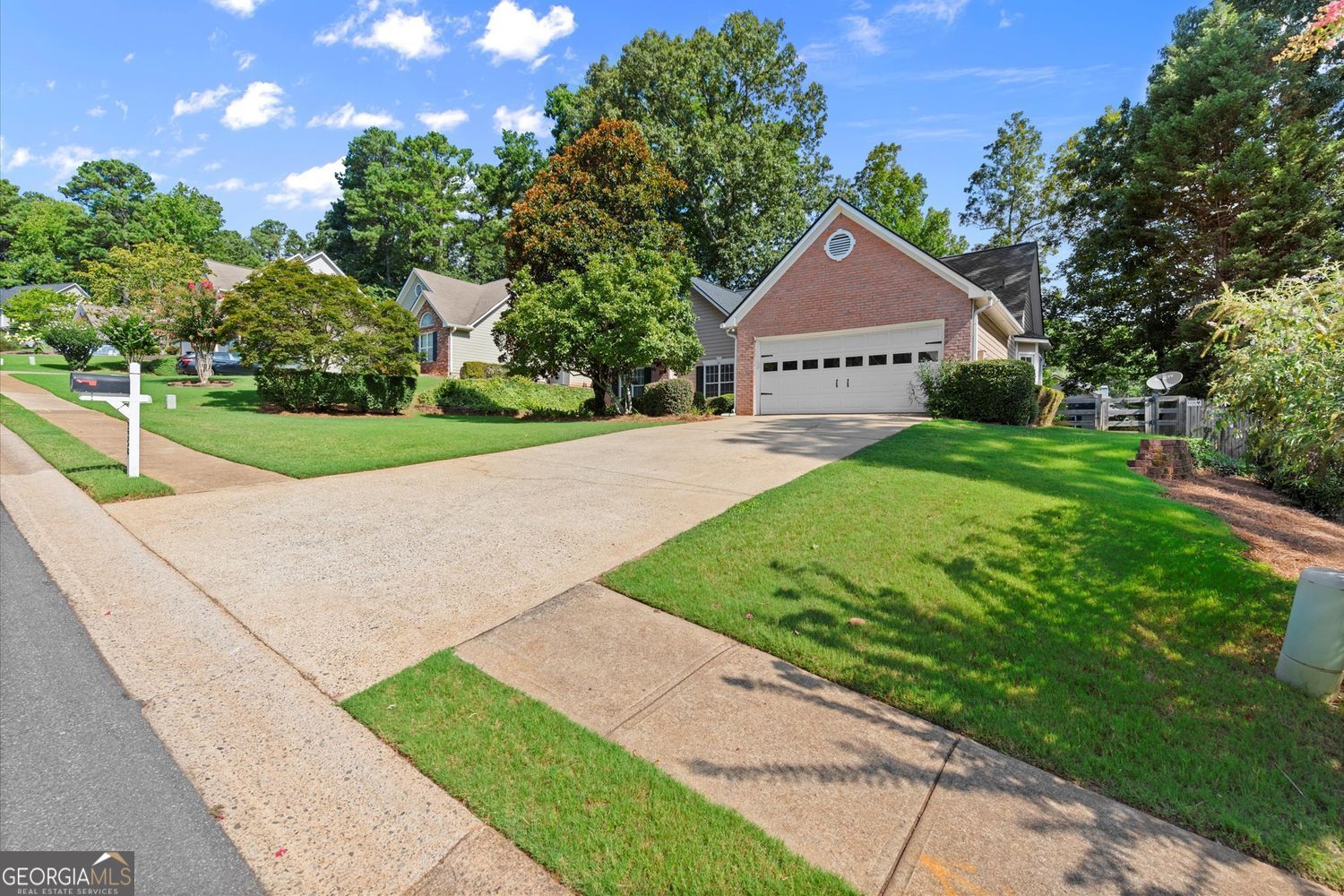 Great 1-Level living in the popular Kennesaw Subdivision of English Oaks! English Oaks is indeed a sought-after subdivision in Kennesaw. The area offers a great combination of convenience and charm, making it attractive to many homebuyers. With 3BR and 2BA, its open concept is accommodating for a family. The white appliances, white cabinets, and solid surface counter, add a modern touch to the kitchen. Freshly painted interior gives it a clean, updated look. The back patio provides a great space for outdoor relaxation. Property has an Irrigation System. The fenced-in backyard is nicely landscaped and there's also a building to use for storage. A new roof (2023) and newer Furnace (2020) should be a comfort to the new owner. A Tankless Water Heater should provide plenty of hot water for the entire family. The fact that the garage can actually fit two cars is a big plus, as many homebuyers appreciate practicality in their garage space. The location is also fantastic, being about 3 miles from Downtown Acworth and less than 1 mile from Downtown Kennesaw, offering easy access to amenities and entertainment options. And being next to Swift Cantrell Park is a definite bonus for those who enjoy outdoor activities and recreation. Moreover, this sidewalk community, with the inclusion of Swim, Tennis, and Pickleball facilities in the subdivision adds great value and opportunities for residents to stay active and socialize within their community. Overall, it's a wonderful opportunity for buyers looking for a combination of comfort, convenience, and amenities in the Kennesaw area.