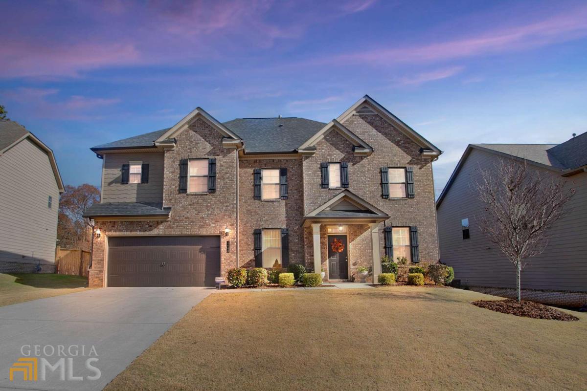 BUYER INCENTIVE!! $20,000 Any Way You Want It-Closing Costs, Rate Buy Down, or Price Reduction-with Accepted Contract! Your Choice! HOME SWEET HOME! This Exceptional 6 BR/4 BA Home Has Been Well-Maintained and is in Turnkey Condition! This home has a bright, open floor plan and is an Entertainer's Dream! It features an executive trim package, 9-foot ceilings on both floors, hardwood floors on the main, and a unique floor plan you will enjoy coming home to time and time again! At the heart of the home is a beautiful, centrally located chef's kitchen that features a stunning 12-foot breakfast bar island with pendant lighting, granite countertops, abundant cabinet and counter space, double ovens, gas cooktop, stainless steel appliances, and enormous walk-in pantry just off the mudroom! The kitchen offers an open view to the oversized breakfast room and most of the main floor! The sunroom is filled with morning sunlight and is the perfect place to enjoy a cup of coffee/tea to start your day! The flex room on the main is ideal for a home office, guest bedroom, or for aging parents and has direct access to a spacious full bathroom! The fireside great room is able to handle oversized furniture and is the perfect place to unwind at the end of a long day! The owner's suite is sure to impress-it offers abundant wall/floor space for furniture, a private owner's retreat, substantial walk-in closet, and delightful ensuite bathroom with granite countertops, dual vanity, garden tub, extra-large walk-in shower, and private water closet! There are no small bedrooms in this home-all guest bedrooms are oversized and feature large walk-in closets! The level backyard receives evening shade, features a large covered party patio, and offers a quiet peaceful environment for barbequing and entertaining family and friends! Residents have direct access to the Big Creek Greenway from the community! Convenient to the Collection at Forsyth, the new Cumming City Center (opening soon), downtown Cumming, and the best shopping, dining, and entertainment Cumming has to offer!