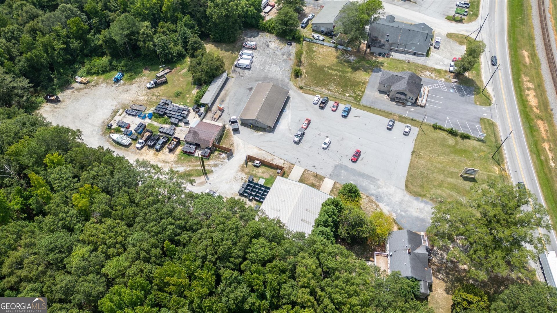 Prime commercial opportunity with 6.54 acres and 3 buildings (6000+ sf), just West of Downtown Douglasville. Excellent location with great visibility, over 119' of road frontage, 10,000 traffic count, plenty of parking, and undeveloped land. Perfect opportunity for single project or commercial development. Start something new or relocate your business and have a few tenants in place. See adjacent listing 12751 Veterans Memorial Hwy. Zoned CG.
