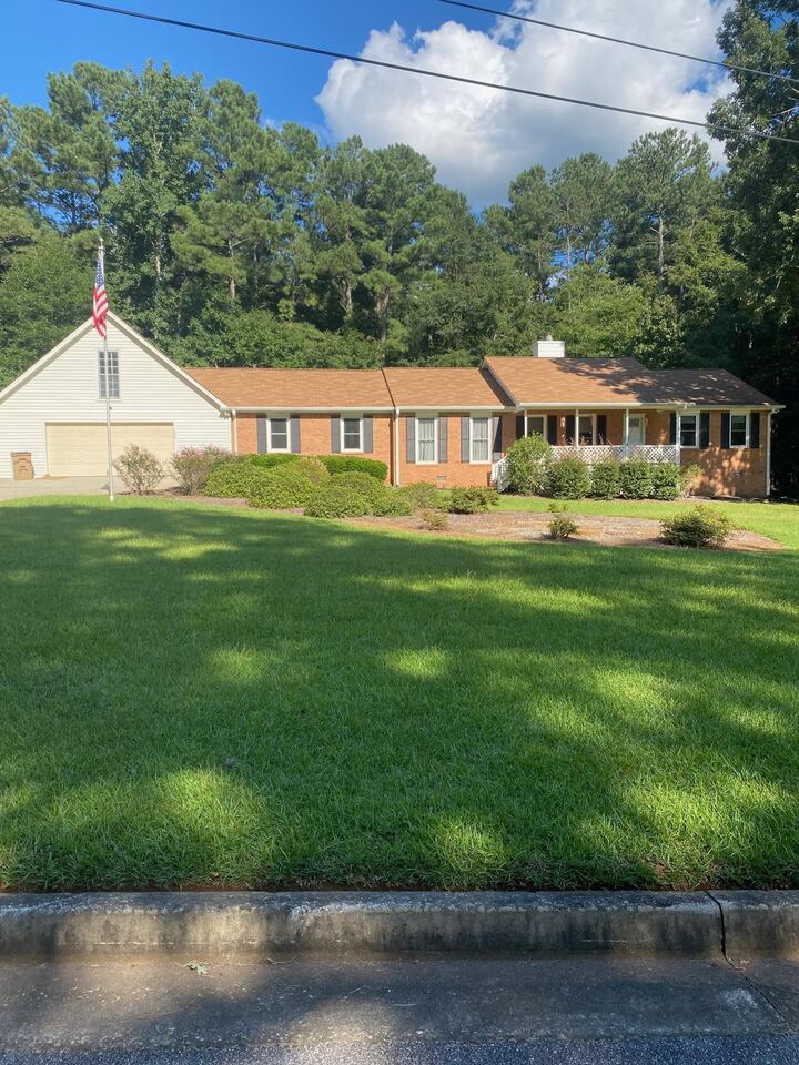 Well kept ranch on double lot. Original garage turned into den, new 30 x 30 garage added. Custom kitchen cabinets with unique pantry which opens up to lots of storage and then folds neatly away. Tile and granite counter tops, sunroom added, this one is move in ready. 4 side brick ranch with added on sunroom and garage, which have vinyl. Additional lot included in sale 085B02011000. NO HOA. Chandelier shown in DR is not remaining. Closing attorney Brochstein & Bantley.