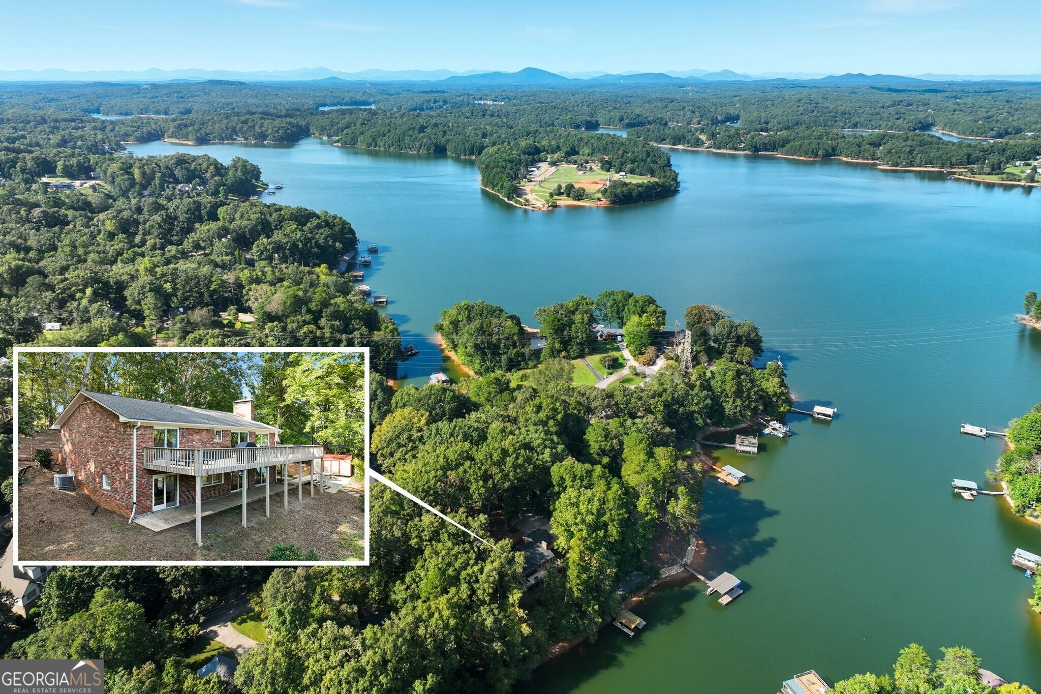 This beautifully updated, cozy lake cottage with stunning lake views from almost every room, deep water, a 32x32 twin slip dock permit - allowing for an easy upgrade, and a grandfathered 100' sea wall with concrete patio, combine to offer a peaceful escape you'll look forward to every day. Situated on a generous .8 acre lot, (2 1/2 platted lots), with Lot 7 remaining undeveloped and a newly installed wood fence in the front yard, this all-brick ranch with finished basement, features 4 bedrooms, 3 full baths, and 2 brick fireplaces. This home offers both a main level and terrace level primary suite, with the terrace level suite featuring a fireplace and custom closet. There is an additional room that can also function as a 5th bedroom, a game room, office space, or additional family room with gorgeous lake views! Outside, you'll enjoy the extensive deck off the family room, and a lower covered patio. Convenient to 985, just minutes from the charming downtown Gainesville Square with shopping, dining, and the hospital, you'll enjoy easy access to these amenities, all while enjoying all this property has to offer. A Radon Inspection/Summary was done in June and is on file. Buyers have loved this home and are selling due to a job relocation. Can be sold furnished with few exceptions. Whether you're seeking a weekend getaway or a year-round oasis, this cottage delivers privacy, unmatched views, and the ultimate lakeside lifestyle. Don't miss your chance to own this special retreat-schedule your private tour today and experience the warmth and beauty for yourself.