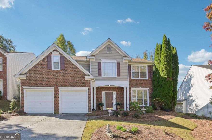 Welcome to this classic brick-front two-story home located in a lovely Canton community within walking distance of the great amenities, including a clubhouse with wraparound porch, large pool, tennis courts, and a playground. The perfect gathering place for neighbors and friends. This home offers wonderful curb appeal with dual garage doors for added privacy, ample parking and storage, and manicured landscaping framing a covered front porch, ready to be decorated for the holidays. Step inside the two-story foyer, where hardwoods flow into a formal living room, ideal as a home office or sitting area and opens to the formal dining room, highlighted by decorative columns and wainscoting for timeless elegance. The eat-in kitchen features an island with breakfast bar, pantry, and an additional dining area, creating a comfortable space for everyday living and entertaining. Easy access to the patio for indoor-outdoor living year-around. The adjoining family room centers around a classic fireplace, perfect for cozy evenings ahead. A half bath completes the main level. Upstairs, a spacious landing provides a quiet reading or sitting area. The primary suite boasts a tray ceiling and French doors leading to a vaulted en-suite bathroom complete with a double vanity and makeup counter, garden tub, and walk-in shower. Three additional bedrooms and an additional full bath, along with a laundry room conveniently located near all bedrooms, making laundry day a breeze. Outside, enjoy a fully fenced backyard offering privacy and space to relax or dine under the stars on the patio. There's also a storage shed perfect for tools, outdoor equipment, or seasonal decor. This home is move-in ready with plenty of opportunity to customize and update to your personal style. Ideally located near grocery stores, parks, schools, and recreational facilities, plus great shops, dining, and downtown Canton favorites. You'll love the perfect blend of comfort, community, and convenience this home provides.