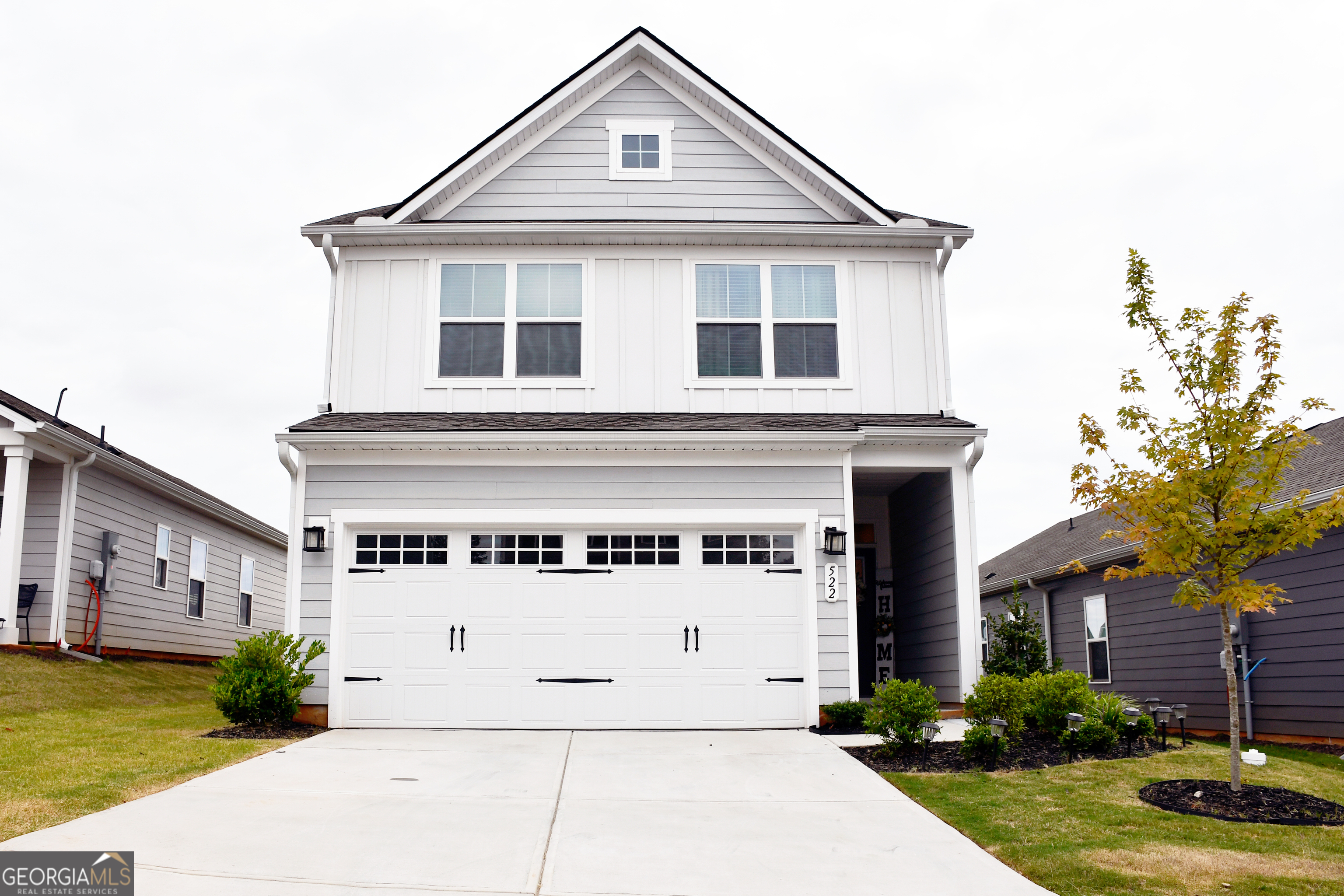 This 2024 home is truly a modern gem with a very welcoming entrance and a double garage. It also features a spacious driveway that can accommodate up to four cars, plus the garage fits two more cars. The upstairs area houses all the bedrooms, and the home features an open floor plan with a kitchen island made of granite. The kitchen has white cabinetry and plenty of natural light thanks to energy-efficient windows. There's a spacious backyard with a lovely green lawn, and the pantry is a walk-in style for extra convenience. Upstairs, in addition to the bedrooms, there's a loft and two full bathrooms. Downstairs, you'll find a half bath. The primary bedroom has a walk-in closet and a double vanity in the bathroom, though it features a shower rather than a tub. There's also an upstairs laundry closet. The home is in excellent condition overall and has luxury laminate flooring.
