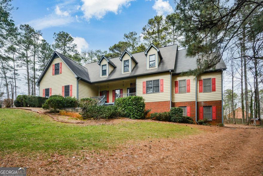 This stunning custom built home that sits on a secluded 3.01 acres with more acreage available is an excellent value in a highly sought -after East Cobb location with easy access to freeways. The 1000 foot driveway to your new home allows you to enjoy the peaceful front porch, back deck, chicken coop, treehouse, fire pit and garden in the privacy of your extensive wooded acreage. You will find tasteful updates in this move-in ready home from the partially finished, air conditioned basement and up-dated chef's delight kitchen with large walk in pantry, 4 ovens, stainless steel appliances and granite counter-tops. There is plenty of room in this spacious home for you all to enjoy and bring it into the 21st century. The main floor has added hardwood floors with the updated kitchen, breakfast nook and laundry room.  The open concept vaulted living space has a 2nd floor indoor balcony with hardwood floors overlooking the 1st floor, a banquet sized separate dining room, built-in shelves and a half bath. The primary suite located on the main floor includes a fireplace, built-in shelves and plenty of closet space with 2 separate walk-in closets. The spacious primary bath has a private water closet, his and her vanities, a walk-in shower and 2 person jacuzzi tub. Behind the master closet is a large room that could be a nursery, office or extra storage space. An enclosed Sun Room/Reading nook/bar has been added to the back deck with bright, large windows that provides a wonderful place to gather. Upstairs you will find the other 4 large bedrooms with updated carpet and ample closet space in each and Jack and Jill baths. There is hallway access to 2 bedrooms with 3 hallway closets. There is indoor balcony access to the other 2 bedrooms and a 2 story attic. A 2 car garage on the main level and a driveway accessible garage door on the basement level for a car or for storage. The full basement gives you plenty of storage or an option for more living space. Plenty of parking space for RV's, a boat or utility trailer.Home security system included. Come and enjoy this relaxing home tucked away private setting by scheduling your appointment today.