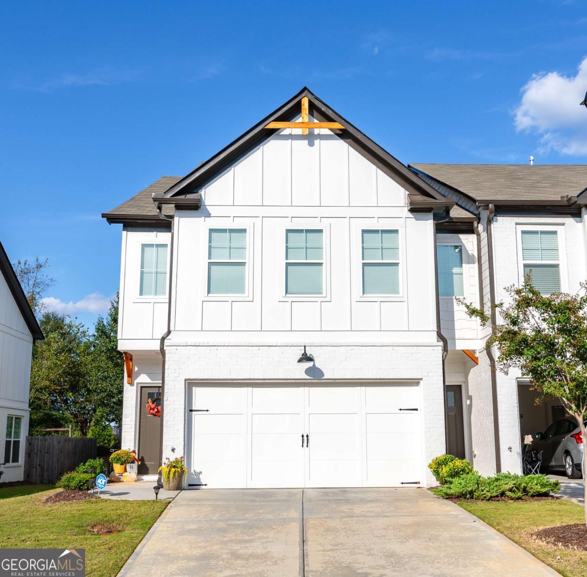 Step into this Modern Exquisite 4-year-old Like-New Townhome. This Stylish Residence offers 3 spacious Bedrooms / 2 Full bathrooms upstairs, and a convenient 1/2 bath on the main level. The main level has engineered hardwood with an open view to the kitchen, gas fireplace and lots of natural light. The kitchen has granite countertops, tile back splash, stainless steel appliances, island, pantry and an eat-in-kitchen dining area. The Owner's suite offers trey ceiling, double vanity, separate soaking tub and stand up fully tiled shower, water closet and a walk-in closet. There are 2 additional spacious bedrooms and a full bathroom that provides a tub/shower combo. Private wood fenced backyard area where you can entertain your family and friends. You will love this unit. Schedule your appointment TODAY! Please call Chavonda Darby (770) 354-3461 cell if you do not have access to ShowingTime.