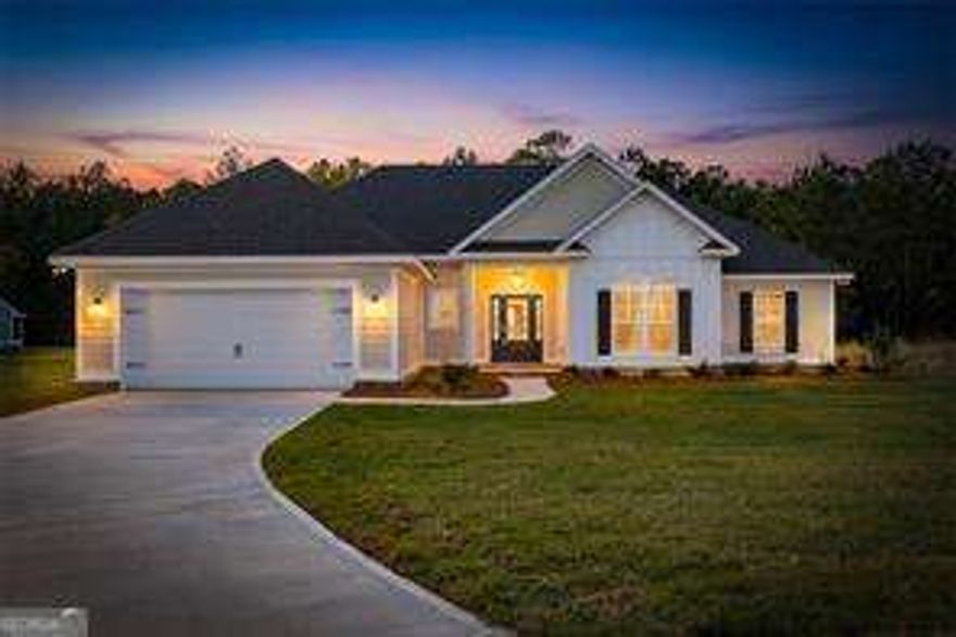 Welcome to this stunning MOVE IN READY brand-new construction located in the desirable River Oaks community. This 4-bedroom, 2-bath home sits on a generous 0.72-acre lot and offers thoughtful design and quality finishes throughout. A charming front porch leads into the foyer and spacious living room, all featuring durable and stylish LVP flooring. The modern kitchen is equipped with stainless steel appliances and includes a pantry with built-in wooden shelving. Adjacent to the kitchen are a convenient mudroom and laundry room. The primary suite is a true retreat with trayed ceilings, a luxurious en suite bathroom featuring double vanities, a separate tiled shower, a soaking tub, and a walk-in closet with custom wooden shelving. Three additional guest bedrooms provide plenty of additional space. A rear porch offers the perfect spot for outdoor relaxation, and a two-car garage adds functionality to this beautifully designed home.