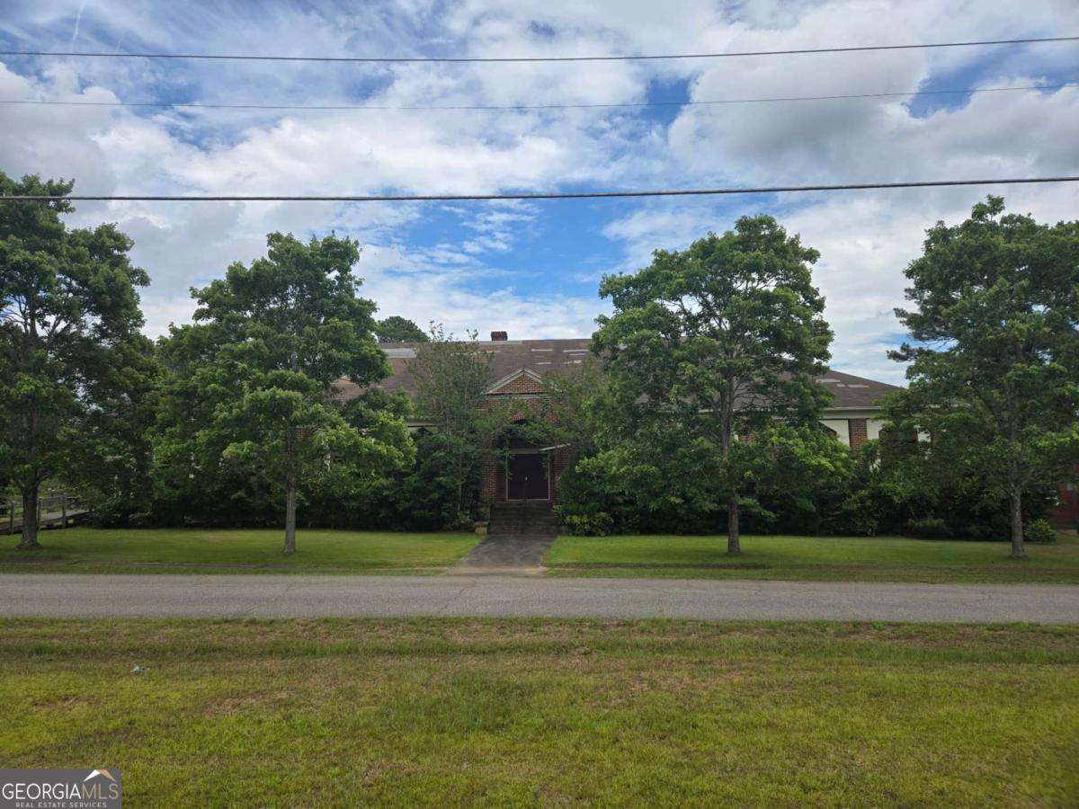Opportunity Awaits with this treasure located in Downtown Comer, GA...Part of the Historic District.. inside the city limits and has already been zoned for commercial/residential use...The possibilities are endless! Restaurant.. Event Center...Apartments.. Take your vision and turn this hidden gem into something really special! The building was originally built in 1906 as a school; it was later used as a church.. with over 15,000 square feet... sitting on a 2 acre corner lot... Current owner has done most of the demolition...the building is in need of repair/restoration...But the structure is solid... Investors: this could be broken up into apartments/condos.
