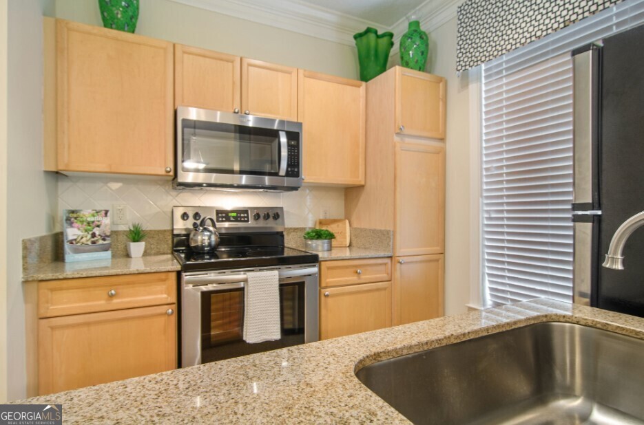 Access to shopping, dining, entertainment and recreation. Easy access to I-85. Built-in bookshelves. Ceramic tile floors. Town Homes with Attached Garages.