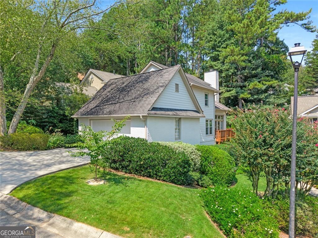 Style, Space and LOCATION! This traditional charmer is perfect and move in ready. Lush landscaped side garden entry welcomes you and guest. Front entry opens to a sunny, light filled foyer. A coat closet and powder room are also at the entry area.A spacious formal dining room, perfect for family gatherings and entertaining, has large windows with garden views. The recently renovated kitchen is the cook's delight. The center island, with custom stone countertop, offers great counter space. Perfect for in-kitchen dining with room for bar stools. Professional grade stainless steel appliance include Miele dishwasher, a 5 burner gas-range/oven, Microwave vent system, and a French door LG refrigerator/freezer with ice/water in the door. Custom cabinetry offer soft open/ close drawers and doors, built-in spice storage pullouts and pullouts for additional kitchen essentials. There is a nice pantry cabinet that also has pull out shelves. Designer granite stone countertops and backsplash too! The sink has a garbage disposal, and a barglas washer feature! There is a full size laundry closet in the kitchen with additional storage and shelving space. access tot he 2 Car garage with auto door is directly off the kitchen. The great room/living room boasts two story ceilings, walls of windows and doors to private deck areas, and a beautiful gas log fireplace with stab stone surround. There is a large walk-in storage closet that takes advantage of under stair space. The owner retreat is fantastic with main level access. Step into a private sitting area or study space that flows into an oversized bedroom, An abundance of windows and double atrium doors lead out to the private deck and rear yard access. The owners bath has a walk-in closet, double vanities with cabinet storage, a jetted spa tub, and private water closet and shower area with custom tile, fixtures, lighting and hardware. a pretty open stairway leads you upstairs to a nice wide hallway that overlooks the family room below. There is a large walk-in cedar lined closet for additional storage. The secondary bedrooms are generous. One bedroom offers double closets, and the other has a private half bath. The hall bath has been recently renovated with designer tiles and hardware, a large shower with custom shower tower spray and shower head, custom vanity and lighting. The home has brand new carpeting in all bedrooms, hardwood floors in living room, dining room and entry foyer. The new flooring in kitchen is LP, as well as the hallway upstairs. The interior and exterior of the home have been recently painted. Move-in ready and enjoy living in one of Atlanta's best neighborhoods, Pine Hills. Shady Valley Park is just down the street with tennis courts and park and play areas. Close proximity to Buckhead, Brookhaven, and Intown dining and entertainment. The Emory Hospital , Children's,Hospital, and Emory sports medicine are minutes away.