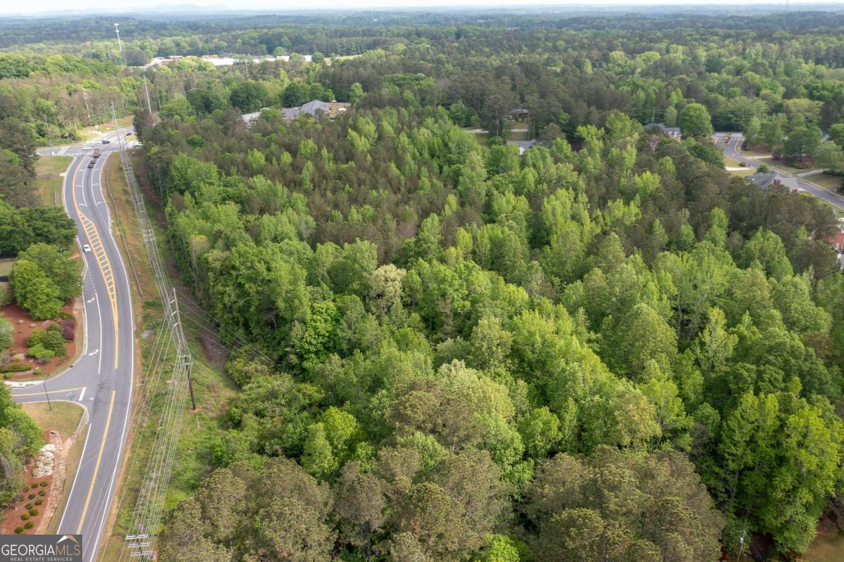 Located at the corner of Mars Hill Road and Old Stilesboro Road, this 12.47-acre parcel is zoned R-30, allowing for 30,000 sq ft minimum lot sizesCoideal for a 15-lot subdivision. The land features a gentle north-to-south slope, with elevations ranging from 934 ft at Old Stilesboro Road down to 894 ft along the southern boundary. This site offers excellent access to Highway 41 and is just minutes from the Brookstone Golf Community, making it a strategic location for residential development.