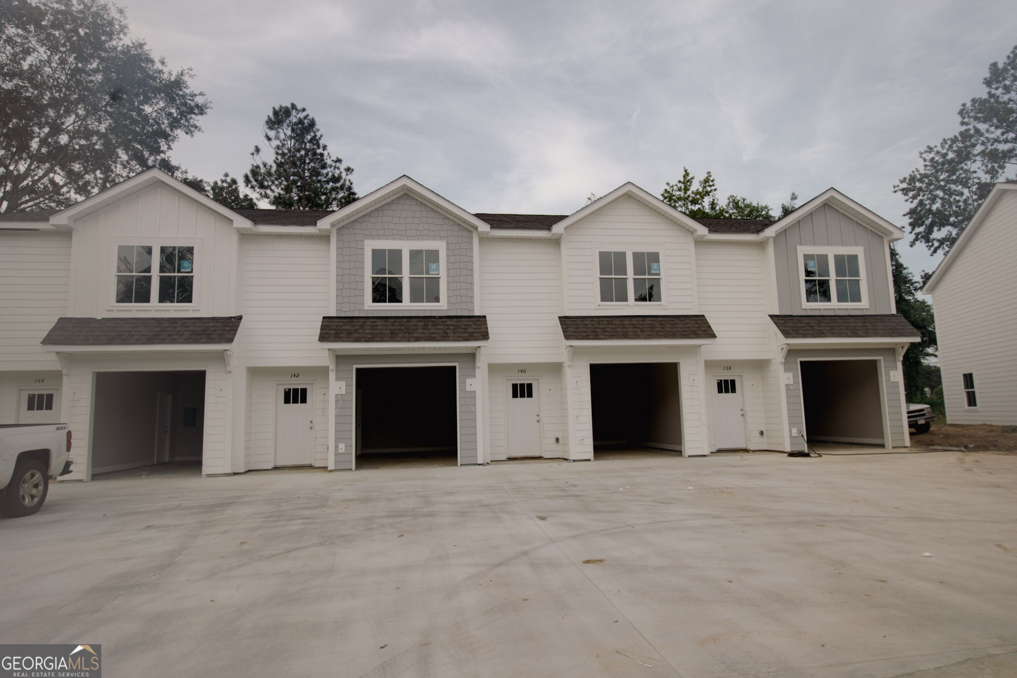 Be the first to call these stunning new construction townhomes home. Offering 1,277 square feet of stylish living space, each residence is designed with comfort and convenience in mind. Step inside to find an open-concept layout with luxury vinyl plank flooring, granite countertops, and stainless steel appliances. The modern kitchen with island overlooks the living area, making it the perfect space for both everyday living and entertaining. Upstairs, two spacious bedrooms each feature their own private bath, while a half bath on the main level adds extra convenience. Enjoy the security of a gated community along with your own private backyard and attached garage. Located just minutes from shopping, dining, and all that Statesboro has to offer, these townhomes bring together the best of modern design and everyday practicality.