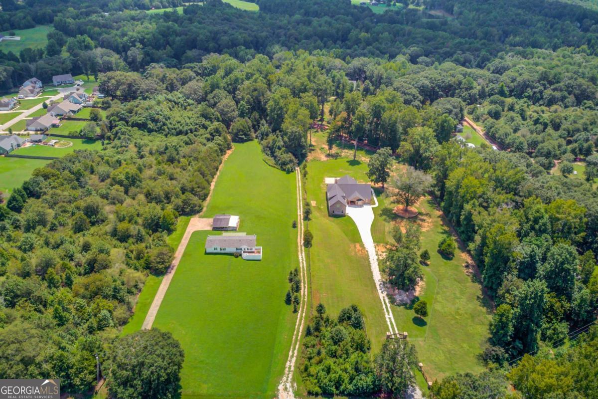 Private 5.79 Acres with Creek - Ideal for Home, Farm, or Recreation! Don't miss this rare opportunity to own 5.79 private acres featuring a picturesque creek, partially wooded landscape, and long private driveway. Perfect setting for a farm, horses, hunting, or building your dream home. Unimproved and ready for your vision. Conveniently located just minutes from downtown and close to local schools. Privacy and potential in a prime location!