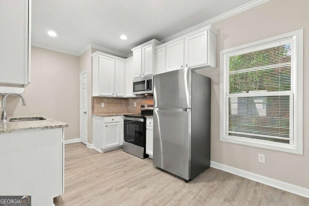 Photo of 84 Holly Road NW, Atlanta, GA 30314 (MLS # 10849990)