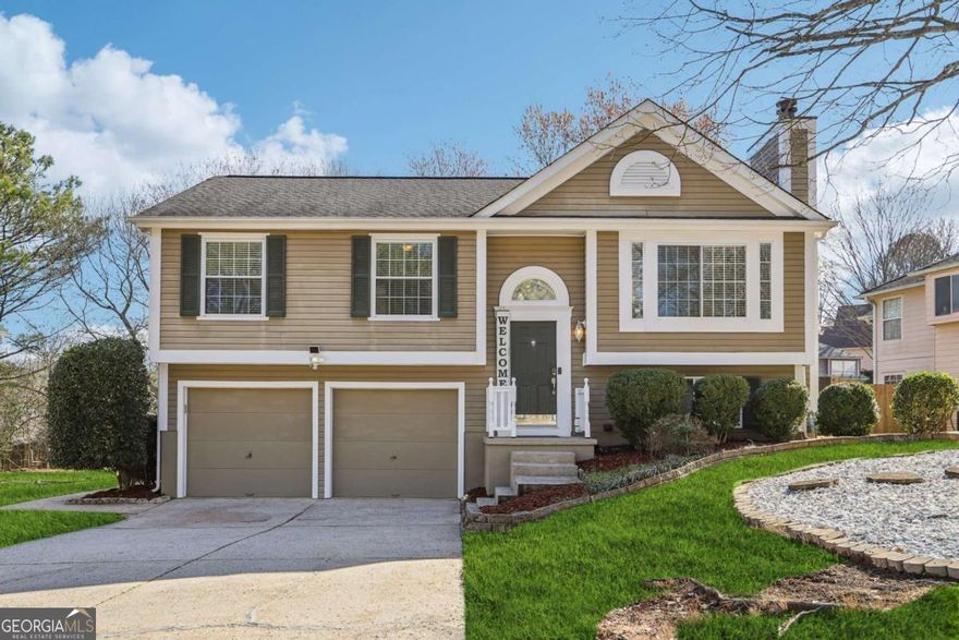 Nestled in a vibrant and welcoming Alpharetta neighborhood, this beautifully updated bi-level home offers 3 bedrooms, 2.5 bathrooms, and a versatile bonus room, blending style, comfort, and smart living. Step inside to a bright, open layout where the living and dining areas flow seamlessly, leading into a fully renovated kitchen with quartz countertops, hardwood cabinetry, soft-close drawers, tile flooring, a stylish backsplash, and enhanced lighting. Elegant custom solid wood doors, new energy-efficient windows with custom blinds, and hardwood floors throughout add warmth and sophistication, while smart features like a Nest thermostat, OneLink Smart Home devices include smoke detectors with Alexa, smart light switches, a Ring security system, and smart locks on both the front door and garage offer convenience and peace of mind. The lower level includes a bonus room with a fireplace, a half bath, laundry room, and access to a two-car garage with smart opener and keyless entry. Enjoy outdoor living on your deck in the beautifully landscaped backyard with motion-sensor lighting, a storage shed, and a remote-controlled sprinkler system. Upgrades continue with newly painted walls, siding, garage doors, gutters, and deck, water-efficient toilets, modernized bathrooms with updated tile and spa-like showerheads, and a new main electrical panel plus termite protection plan. Located in a community with a park, playground, basketball court and green space, and just minutes from GA-400, Big Creek Greenway, Chattahoochee River, Wills Park, Avalon, and North Point Mall, this home offers thoughtful upgrades, unbeatable location, and everyday comfort-truly a rare find at this price.