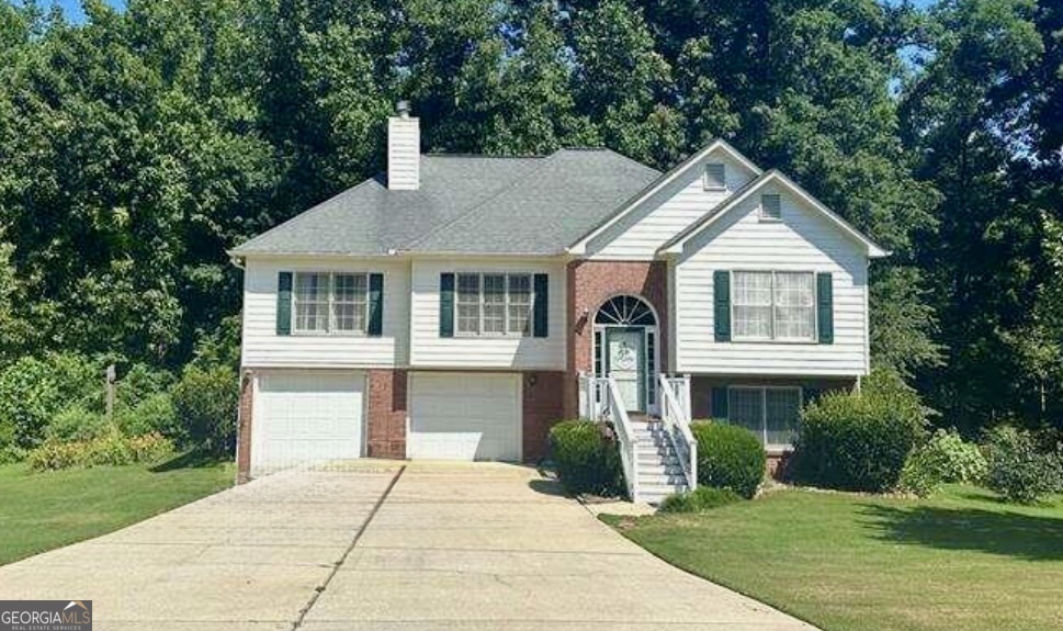 Welcome to 284 Legend Creek Lane in Douglasville-Located in Beautiful Paulding County! Enjoy 2300 sq ft of living space on a generous 1.38-acre lot that includes the neighboring parcel (330 Legend Creek Lane). A creek runs all the way across the property, adding a peaceful, natural touch to your backyard views. This well-designed home features 4 bedrooms and 3 full bathrooms, including a downstairs suite with a bonus room, bedroom, and full bath-ideal for guests, extended family, or a private workspace. The heart of the home features a cozy fireplace, ideal for relaxing evenings! The kitchen offers above-grade appliances, plenty of cabinet space, and a charming window seat overlooking a serene lake view. Recent upgrades include a new water heater and new septic tank and lines, giving you both comfort and confidence. With space to spread out, scenic views, and thoughtful updates, this one truly has it all-inside and out. Schedule your showing today!