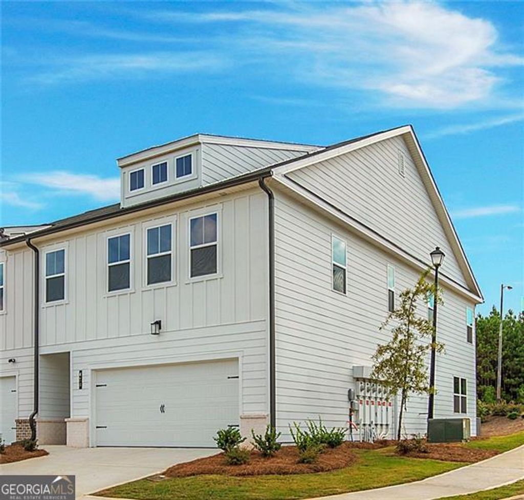 Photo of 410 POINT PLACE Drive, Loganville, GA 30052 (MLS # 10658087)