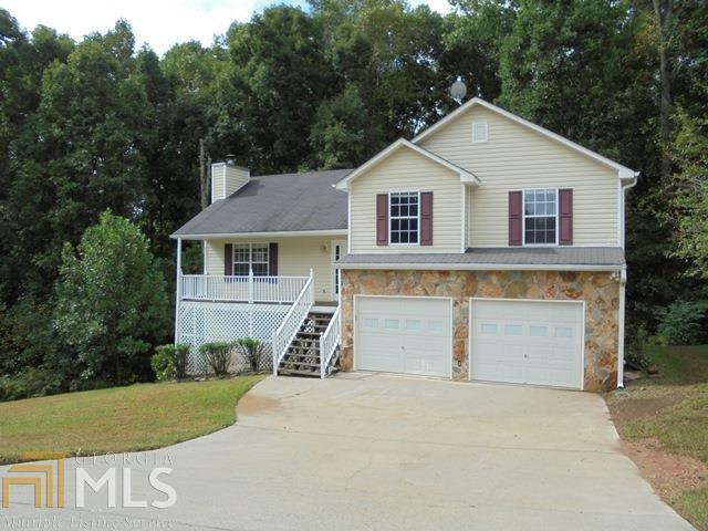 This beautiful 4BR & 2BA split level home on 1.79 acres on a cul-de-sac lot features vinyl exterior with stone accents, foyer entrance, vaulted ceilings, wood burning fireplace in family room, separate dining room, large eat-in kitchen, spacious master bedroom with trey ceiling, partial basement finished stubbed for bath, deck overlooks private backyard. All appliances included. Must see!