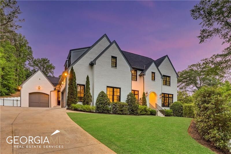 Stunning newer construction home by Crestar in the heart of Chastain Park with a magnificent backyard oasis including a professionally turfed landscape, pool house, salt water pool and spa, basketball court, putting green, and fire pits - this is truly an entertainer's dream! Flawlessly designed home with beautiful hardwoods, detailed millwork and designer lighting throughout. Light filled eat-in kitchen includes ceiling-height cabinetry, Viking and Subzero appliances, quartz counters, and an open layout flowing into the family room with foldaway accordion doors to fireside screened porch. Additional features include a mudroom off of 3 car garage, desk/office area, and Butler's pantry. Primary suite with 2 walk in closets and spa like marble bath. Spacious en-suite secondary bedrooms. Finished terraced level with gym, living area. Fully equipped pool house with kitchen and grill, built-in heaters, full bath, living area/flex space, laundry room, wall of TV's. Whole house generator and gated driveway. Walk or golf cart to Chastain Park, NYO, restaurants. Top rated Jackson school district and minutes to area private schools. This property is ALL about the lifestyle of city living with every amenity imaginable!