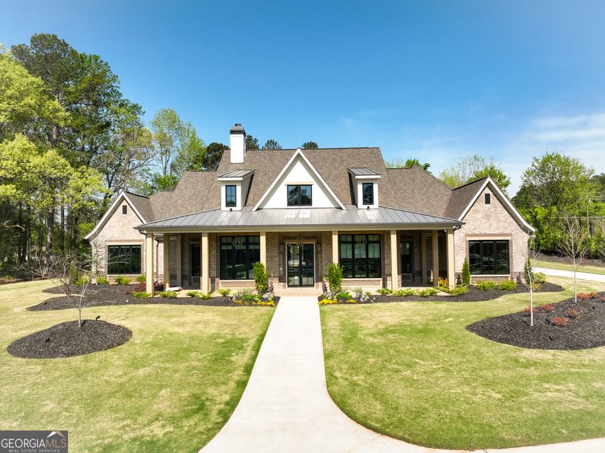 Welcome to your dream home! As you enter the driveway, you are greeted by two elegant columns adorned with beautiful gas lanterns, setting the tone for the charm and sophistication that awaits. Meticulously designed and built with the highest quality materials and cutting edge technology, this home is the epitome of modern luxury and durability. Every detail of this brand New Construction Home has been thoughtfully curated ensuring a unique and luxurious living experience. From the custom built details to the high end finishes. This Craftsman-style home offers luxury living in Alpharetta's sought-after Cherokee County. No detail has been overlooked! Boasting exquisite brick construction this home exudes elegance and charm. Nestled in Alpharetta, Georgia, this property offers the perfect blend of suburban tranquility and urban convenience. Enjoy easy access to top-rated schools (Avery, Creekland, Creekview and The Haven Academy), parks, shopping centers, and dining options. Experience culinary excellence with top-of-the-line appliances. Elevate your living space with locally crafted custom cabinets. Enjoy the timeless beauty and durability of stain in place hardwood flooring throughout the home. Our properties feature exquisite high performance concrete countertops with built-in sinks. Entertain in style with a fully equipped outdoor kitchen featuring Wolf and Sub Zero appliances. Relax in the shade of your 1000CO square foot covered patio, adorned with elegant herringbone solid brick detailing. Built in heaters on the patio will keep you cozy on those chilly nights. Prepare to be amazed by the meticulously designed master closet, perfect for that discerning client. Enjoy the luxury of heated Master Bathroom tile floors. From intricate trim work to designer fixtures, this home is filled with upscale details that set it apart from the rest. Prewired EV garage outlet. Control your HVAC, Lights, Surround Sound, and Lutron Window Shades effortlessly from your smartphone. Our roofing materials are made with F Wave premium synthetic roof shingles and offer a lifetime warranty. They are made to with withstand 130 mph winds, Class 4 Hail, and Class A fire protection. Our Casement windows are backed with a 10 year warranty (20 year glass warranty). With too many upgrades to mention, this home offers luxury living at its finest. In addition to the main living and bonus square footage, this home includes an additional 2411 square feet (front and rear porch plus garage) for a total of 6434 square feet (under roof and all other areas). Showings scheduled upon receipt of Proof of Funds (POF) or PreQual Letter. Listing agent will be present for all showings to provide intricate details of this exquisite property. This subdivision will have a total of 7 New Homes and is a Preplanned Community. Individual Lots are not for sale. Backyard is approved for an inground pool.