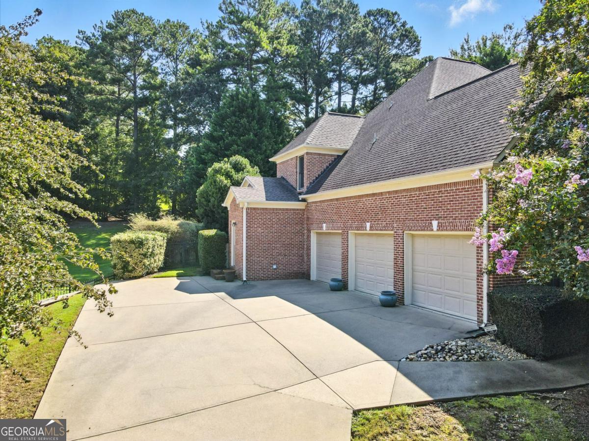 Welcome to 1383 Bridge Mill Avenue, where thoughtful design and functional living come together in one of Canton's most desirable neighborhoods. This home checks all the boxes for comfort, convenience, and future potential. Inside, you'll find a stunning two-story living room filled with natural light from windows galore, creating an inviting and open atmosphere. The main level features a spacious primary suite, plus a secondary bedroom and full bath-ideal for multigenerational living, a private guest retreat, or a dedicated home office. Everyday ease is elevated with a main-level laundry room complete with a water basin for added convenience. The home also offers incredible expansion possibilities. The unfinished basement provides abundant storage and is already stubbed for a bathroom, giving the next owner flexibility to create a custom space. Car enthusiasts and hobbyists alike will appreciate the oversized three-car garage with room for vehicles, tools, and projects. Step outside to discover one of the property's rarest features-a true walk-out backyard. Perfectly suited for entertaining, gardening, or simply enjoying the outdoors, it seamlessly blends indoor and outdoor living. Set in a beautifully maintained community known for manicured lawns and a well-run HOA, this home is more than just a place to live-it's a lifestyle. Make a great deal even better with massive savings through special loan programs with the Preferred Lender Envoy Mortgage with Aubrey Wilcox! Ask the Listing Team for the introduction for interest rates in the 4s!