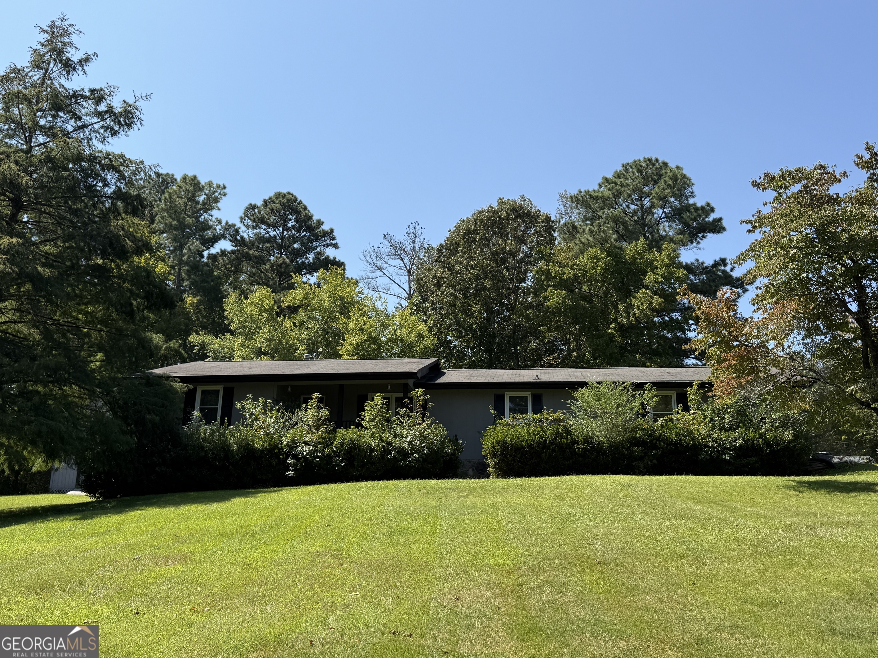 Located in the highly sought-after Bremen City School District, this charming ranch home sits on nearly one full acre in a beautiful park-like setting. The inviting split bedroom plan offers an oversized master suite conveniently located just off the kitchen, along with two additional spacious bedrooms, dining room and a large living room featuring a wood-burning fireplace with a striking stone accent. The sunny kitchen is a delight to cook in, and hardwood floors flow throughout the entire home, adding warmth and character. Outside, you'll find two storage buildings, including a smaller shed for everyday use and a larger shed with endless possibilities...tiny home, playhouse, workshop, or hobby space! With so much to offer and priced to sell, this home is a rare find that you won't want to miss!