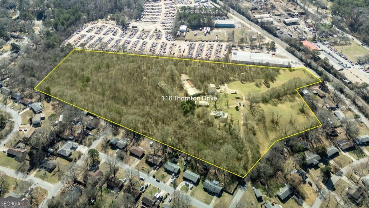 Don't miss this great investment or residential development opportunity! This home is parcel 1 of 2 being sold together, not subdivided, and is situated on a total of 16.93 private acres, fenced and gated. Two property entrances, one on Turner Road and one off Jodeco Rd, works for ease of access for a small hobby farm or residential in/out access. This is a single-family home originally built on over 50 acres in 1952, featuring 3 bedrooms and 1 bathroom within approximately 1,490 square feet of living space. This home includes a crawl space and is equipped with gas heating. Currently situated on a 5-acre lot, this lot adjoins the 11.93 acres that is being sold for a total of 16.93 acres, the property offers a spacious environment with potential for various uses . The home can be updated as future residence for use as a hobby farm or razed for neighborhood development. The lot is zoned for residential and light industrial use (LI), providing opportunities for expansion or development. Located in Clayton County, the home is in proximity to local schools, including Suder Elementary School, Mundys Mill Middle School, and Jonesboro High School. The area offers convenient access to shopping, dining, and entertainment options, making it a desirable location for potential homeowners and developers. * Parcel 2 is an adjoining 11.93 acres with outbuildings, barn, shed, a large 10x40 workshop and smoke house. There is a retention pond on the property, all utilities available.