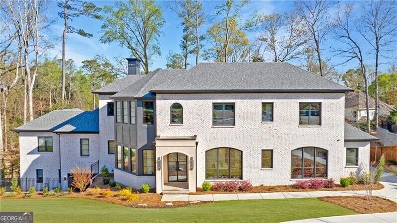 Stunning home meticulously maintained home on a quiet street in North Buckhead! Thoughtfully built by Sheehan Built Homes in 2024, this custom build has left no detail untouched. Light filled entrance foyer leads to the formal living and grand staircase. The great room sits in the back of the house with fireplace. The chef's kitchen is truly unmatched with waterfall island, gorgeous custom cabinetry and open to the breakfast room. Kitchen is complete with spacious walk-in pantry, Wolf and Subzero appliances including convection steam oven located in the scullery. Office, mudroom and laundry room is right off the 3 car garage. Primary suite has its own wing in the back of the house and over looks the backyard. Luxurious primary bath with dual vanities, separate tub and shower. The primary walk-in closet is spacious and offers dual sides. The grand staircase leads to 4 secondary bedrooms, 3 bathrooms, bonus room and secondary laundry. Finished basement has it all, wine cellar, media room, large recreation room that opens to a kitchenette/bar, ideal for entertaining. Guest bedroom with en-suite bath as well as an additional powder room and gym, plenty of unfinished storage space. Elevator for all three floors. Level backyard with patio with fireplace and built-in grill. There is an option to add a pool to the main level patio, the plan is in the photos. Truly a must see home!