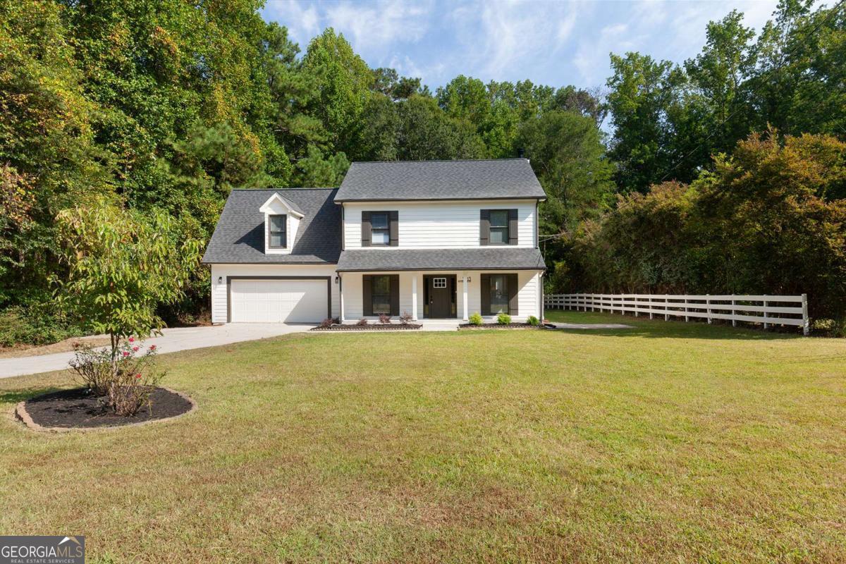 Tucked away on a quiet street in the Hillgrove High School District, this newly renovated traditional home offers the perfect mix of space, comfort, and charm for the whole family. The heart of the home is the bright eat-in kitchen with oak cabinets and stainless steel appliances, opening to a cozy fireside living room where everyone can gather. Upstairs, the spacious master suite is a true retreat, featuring his-and-hers closets, a flexible bonus room that works beautifully as a playroom, home office, or workout space, and a private bath with double quartz vanities and floor-to-ceiling tile. Three additional bedrooms share a convenient hall bathroom, giving everyone their own space. The oversized backyard is perfect for kids to play, pets to roam, and family cookouts on the large deck. Surrounded by privacy and quiet, it's a wonderful place to come home to at the end of the day. This welcoming home offers everything a family needs-room to grow, modern updates, and a peaceful setting in sought-after Cobb County.