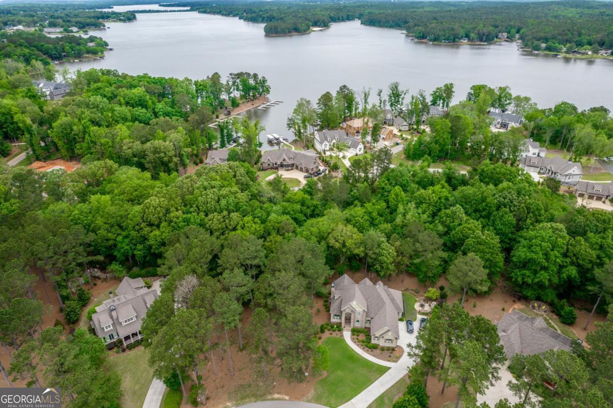 Build Your Dream Home in Cuscowilla - Prime Level Lot with Assigned Slip Dock & Golf Membership! Seize the opportunity to create your dream home in the prestigious Cuscowilla on Lake Oconee! This level lot is ideal for a main-level walkout design, offering effortless access to outdoor living and lakefront enjoyment. Located in one of Georgia's most sought-after golf and lake communities, this homesite includes a 24-hour assigned slip dock, ensuring convenient access to Lake Oconee for boating, fishing, and watersports. Plus, with a golf membership included, you'll enjoy the award-winning Coore & Crenshaw-designed golf course, a stunning clubhouse, and top-tier amenities that make everyday living feel like a vacation. Whether you're looking to build your forever home or invest in one of the area's finest communities, now is the perfect time to secure your piece of Cuscowilla. Don't miss out on this exceptional opportunity-schedule your private tour today!