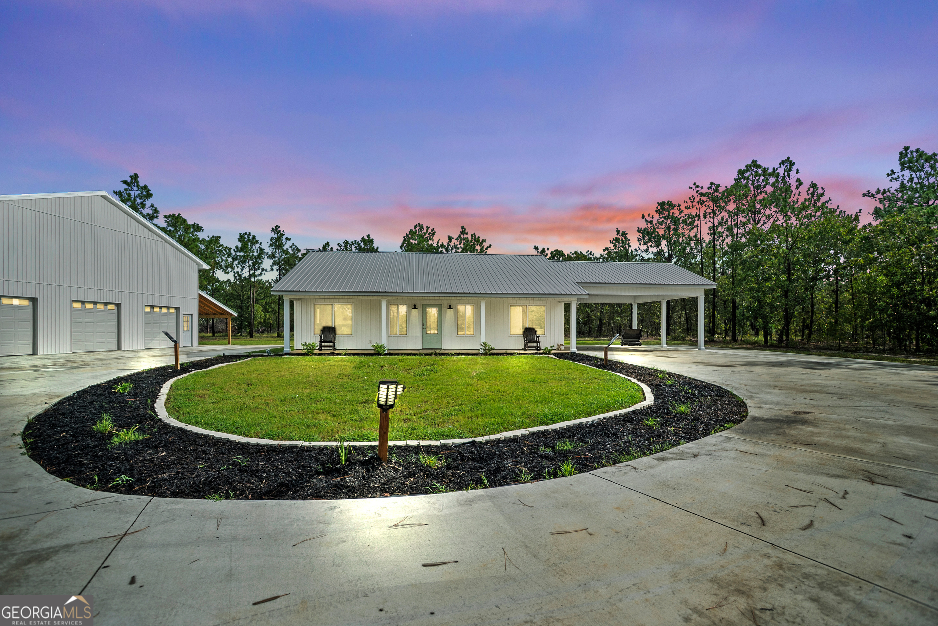 This beautiful home, constructed just last year (2024) has 2 bedrooms and 2 bathrooms. With its modern/farmhouse style, it is surely a must see! Complete with a mud/laundry room and a 2-car attached carport! The lighted mirrors in the bathrooms are a plus along with a gigantic 48x48 x(16tall) shop. Seller was in the process of making the shop a 4 bedroom, 2 bath structure, with plans of the 2 bed/2bath home as a mother-in-law suite. It is conveniently located near I-16, which makes for easy commute to/from Savannah-Macon-Atlanta.