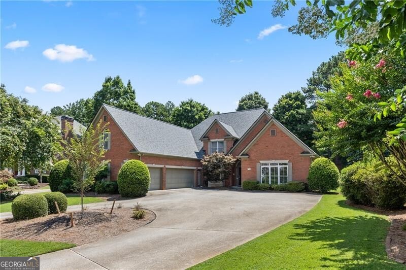Incredible Opportunity in the Coveted Nesbit Lakes Community! This stunning four-sides brick home offers a spacious and thoughtfully designed open floor plan. The inviting entry foyer is flanked by a formal dining room and formal living room, and flows seamlessly into the dramatic two-story grand room with fireplace-perfect for entertaining. The chef's kitchen is a true standout, featuring stainless steel appliances, new cabinetry, stylish backsplash, and a sleek vent hood. Gleaming hardwood floors run throughout the main level. The expansive primary suite is conveniently located on the main floor and boasts an updated spa-like bathroom with granite-topped double vanities, an oversized double-headed shower, and custom his-and-hers closets. Two additional bedrooms on the main share a full bath, and there's also a half bath for guests. Upstairs offers even more space with a loft area, a private office, two additional bedrooms each with en-suite baths, a second half bath, and a large bonus room-ideal for media, playroom, or workout space. Additional highlights include a 2-year-old roof, 3 new HVAC systems, a 3-car side-entry garage, a Circular driveway, and a Fenced backyard with screened porch and brick paver patios. Abundant storage throughout! Enjoy resort-style living with fantastic community amenities including swim, splash park and kids pool, tennis courts , pickleball courts, clubhouse, playground, fire pit area and access to 2 large scenic lakes. Conveniently located within walking distance to top-rated private and public schools and easy access to GA 400, Historic Roswell, Downtown Alpharetta, and Avalon.