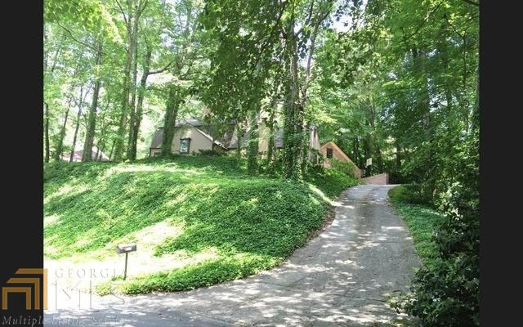 Renovated home that is move in ready in desirable East Cobb swim, tennis & lake community. This home offers plenty of privacy with a low maintenance yard and winter views of the lake. New hardwood floors through out the home, Freshly painted interior & exterior. New lighting. Tuned UP HVAC. Kitchen has new stainless steel appliances & a breakfast room. Renovated bathrooms with new vanities, fixtures and tile. Most doors are new. Newer roof. Huge family room with fireplace. The living room also has a fireplace. Master on main level. HUGE garage with storage space above.