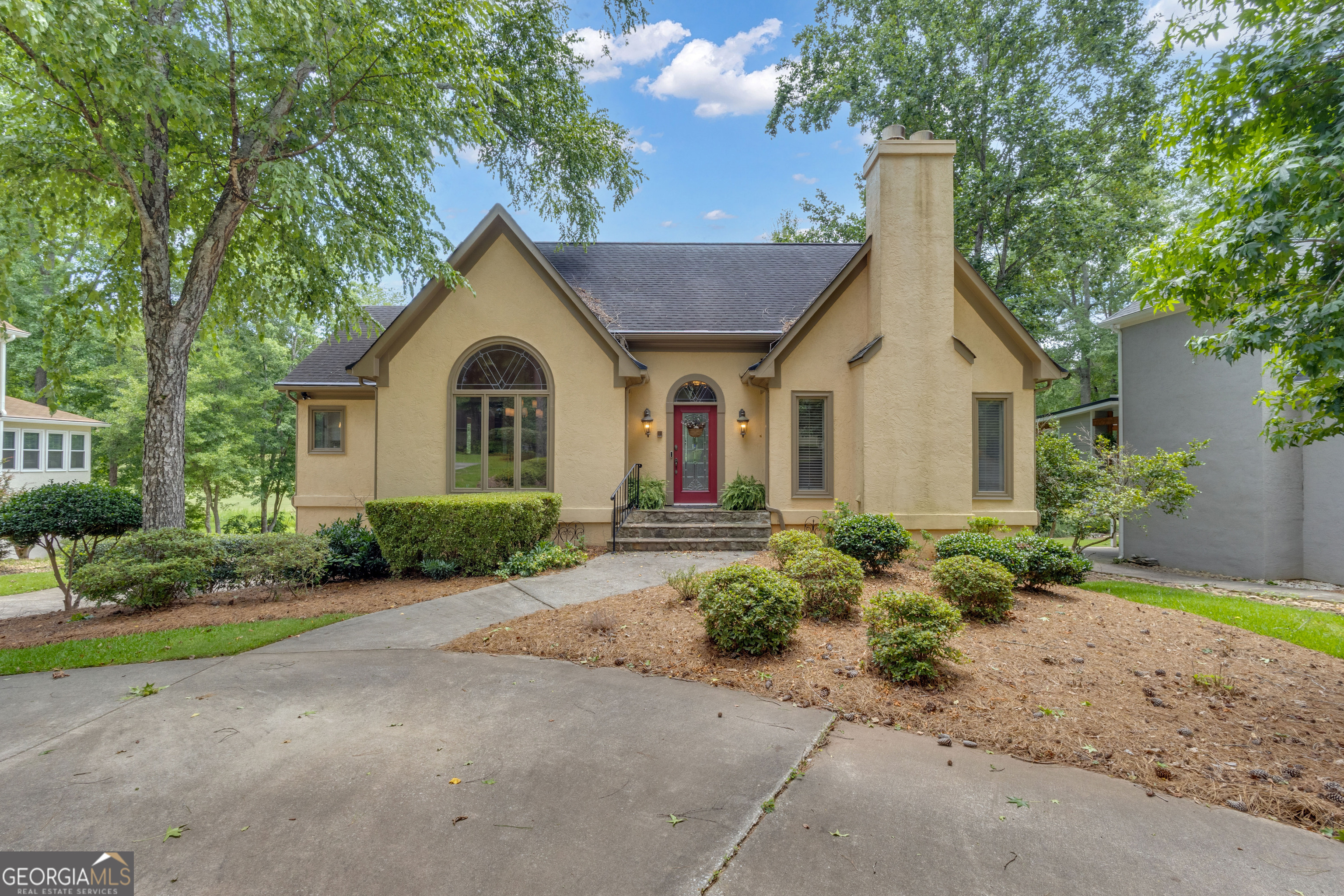 Welcome to 110 Tamerlane - an immaculate home nestled along the 8th fairway of Braelinn Golf Club in the heart of Peachtree City, located within one of Georgia's most sought-after school districts. This beautifully maintained 3-bedroom, 2.5-bath home combines timeless style with modern functionality. Soaring ceilings, rich hardwood floors, and an open, sun-filled layout create a warm and inviting atmosphere. The spacious kitchen is ideal for family gatherings and entertaining, flowing seamlessly into the comfortable family room with a nice fireplace - perfect for relaxing at the end of the day. The generous primary suite on the main level features a walk-in closet, tiled shower, double vanity, and soaking tub for a true retreat feel. Upstairs, two additional bedrooms and a full bath offer plenty of room and flexibility for family or guests. Step outside to the screened-in deck - an ideal spot for morning coffee or evening sunsets while enjoying views of the golf course. The fully finished basement adds even more possibilities, perfect for a media room, home gym, game area, or hobby space. With a premier golf course setting, no HOA, and convenient access to Peachtree City's golf cart paths, shopping, and top-rated schools, this is a rare opportunity you won't want to miss. Come see 110 Tamerlane for yourself and experience all it has to offer!