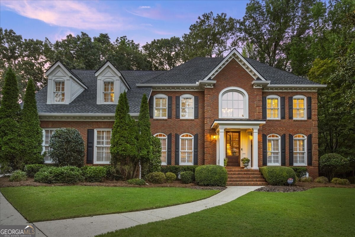 Welcome to this Rare and Beautiful Home in Neely Farm...one of Peachtree Corners top neighborhoods! This custom home is on a cul-de-sac and backs up to 223-acres of Simpsonwood property which has 2,140 linear feet of river frontage along the Chattahoochee River. You will find serene and private views all year! High Ceilings, open floor plan, HARDWOOD floors, a private covered porch with a gorgeous stone fireplace, lots of seating, and a dining area. An incredible area to entertain especially when you bring the outside in by opening the two sets of double doors from the covered porch that leads into the sunroom and dining room. The open kitchen has a large granite island that seats 5, houses a 2 drawer frig, and lots of extra island cabinet storage, Bosch stainless appliances, kitchen dining area and sunroom! Two story vaulted family room with a beautiful Stone fireplace, bookshelves, wall of windows that showcases plenty of natural lighting and nature views. Main level also includes a dining room, living room, a two story foyer with a gorgeous mahogany door, and a bedroom with full bath. Upstairs primary bedroom is an oasis that includes a siting area, upgraded custom bathroom with a soaking tub and walk-in enclosed glass shower with dual shower heads, 2 walk in closets with built-ins, 3 secondary upstairs bedrooms and 2 additional upgraded custom bathrooms. The laundry room is upstairs with a sink and upper cabinets. A fully finished walkout basement with an additional room that can be used as a 6th bedroom, full bath, and 2 large additional rooms which can be used as an entertainment area and a gym/office/recreation area. There is a large storage room as well. Neely Farm has a 20-acre River Park with walking trails along the Chattahoochee and Fields for picnics & ballgames! Neely Farm has a junior Olympic sized pool with active swim team, basketball court, playgrounds and 6 tennis courts with Active ALTA, USTA & T2 teams. Minutes from the Forum and P'tree Corners brand new Town Center where you'll find lots of great restaurants, shopping and an Events Calendar filled with entertainment for everyone. Minutes from Wesleyan School. This Property Won't Last Long!